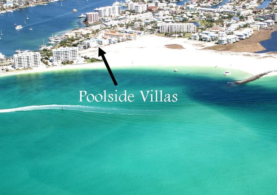 Poolside Villas is a small 30 unit condominium complex surrounded by the natural beauty of the Destin Harbor and Gulf of Mexico. This 2 bedroom, 2 bath end unit offers tile flooring throughout, mirrored walls in the dining area, open living area with lots of windows overlooking the Destin Harbor. The condo features two balconies one in the front facing the Gulf/East Pass and one in the back with panoramic views of the harbor. Poolside Villas is complete with gated entry and pool.