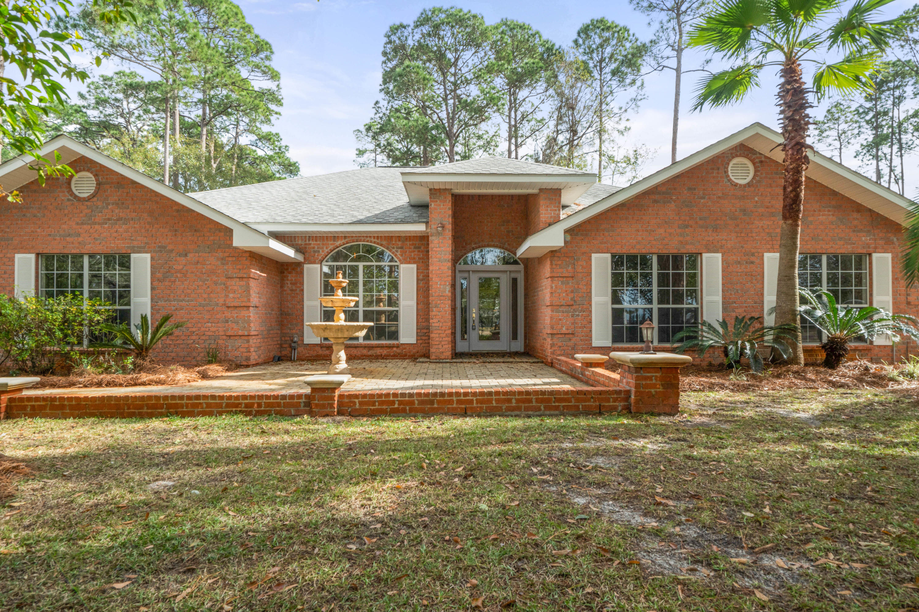 This home is privately located on the exterior of Driftwood Estates and is sitting on more than half an acre lot with Bay views from the front yard. Large fenced in backyard that includes bricks available to build a garage or storage shed. Beautiful open floor plan that includes an office or dinning area off of the entrance.