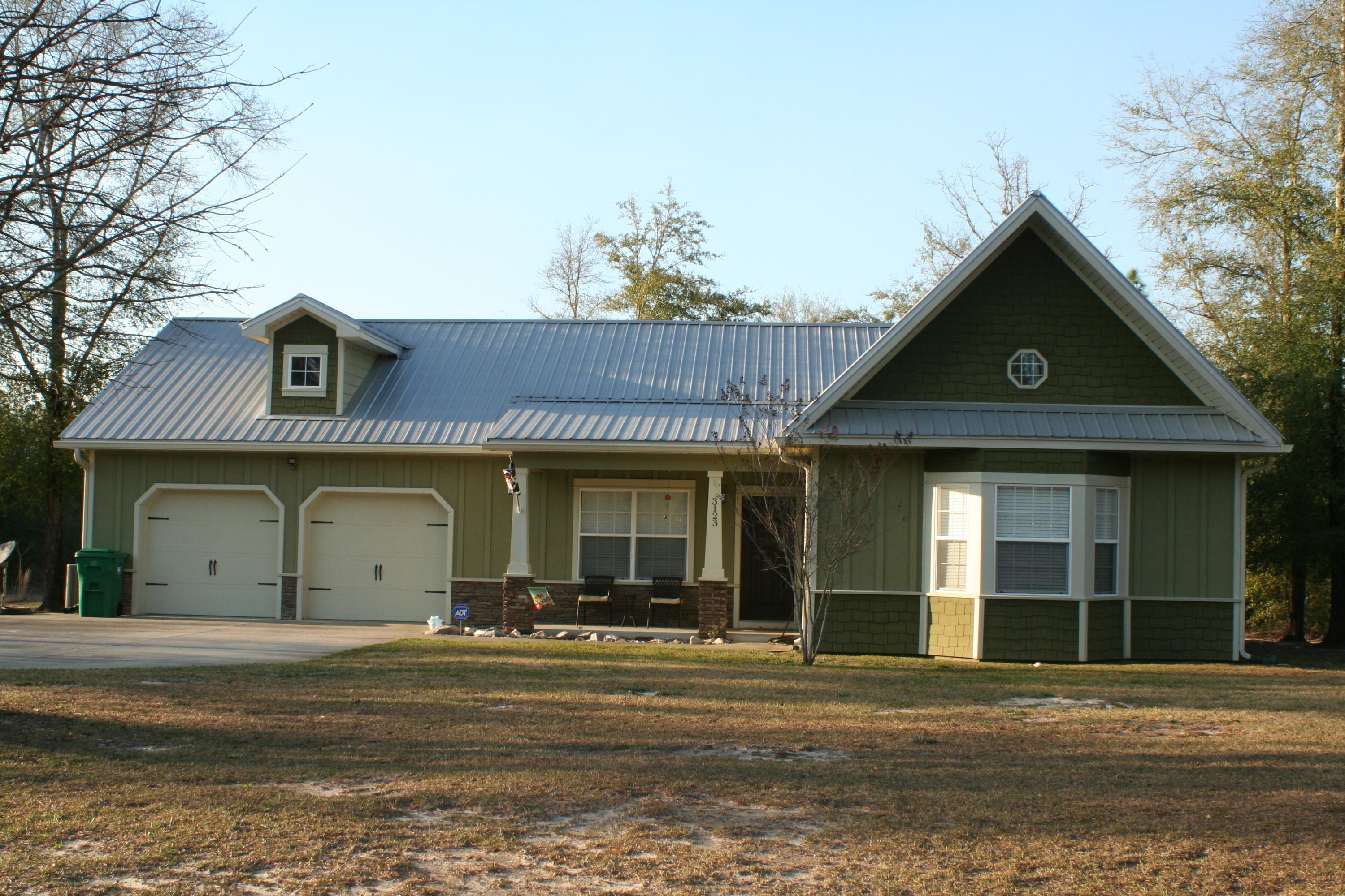 You will love the Craftsman style and new world energy efficiency in this 3 bedroom 2 bath split floor plan!!Superior concrete building system, Florida Green Building Coalition certified, state of the art insulation, NEW 14 SEER HVAC with variable speed fan giving an overall 15 SEER rating making the utility costs unbelievable! Seller says average electric bill is under $130. Granite countertops, breakfast bar and gorgeous cabinets are featured in the kitchen. Vaulted ceiling in the great room, kitchen dining and master bedroom. Master bedroom features a beautiful bay window. Laminate and tile floors with new carpet in the bedrooms. This quiet subdivision offers a private pond, wooded areas for outdoor adventures. See it today!