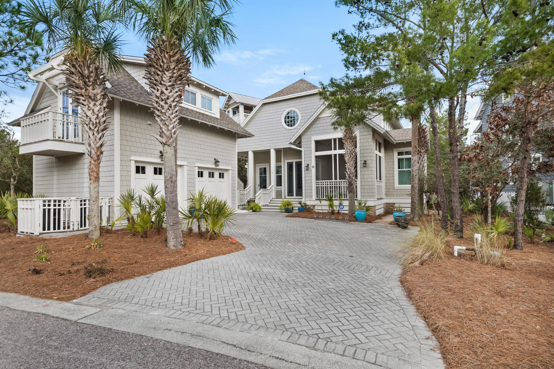 Exceptional offering in the Bridges section of Watersound Beach. Enjoy access to some of the finest amenities on 30A from the coastal dune lakes to the Gulf. This home offers a very inviting floor plan, designed for easy transition between indoor and outdoor spaces. The main living level invites you with multiple entry points as well as  numerous screened porches. The layout includes a master on the main, and open floor plan with the kitchen/living area. The living room is coupled with vaulted ceilings as well as a fireplace. There is also an adjacent den with fireplace. In addition to the formal entry you will find  an additional entry with seamless flow from the outside that brings you into the mud room, then moves you into the laundry room and butlers kitchen area. The upstairs is