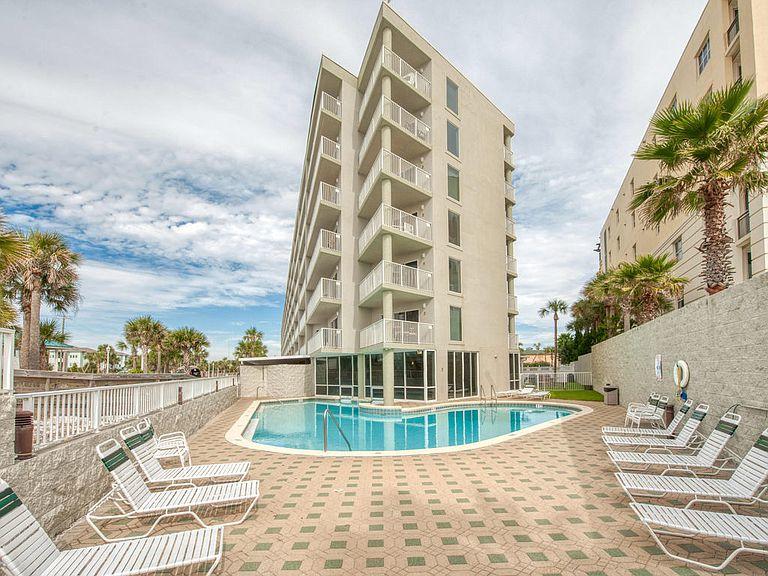 The Best Value steps from the Beach! the gorgeous 2 Bedroom and 2 Bathroom condo is an amazing rental powerhouse and approved for VA financing. the 3rd floor balcony view faces west and looks over the neighboring county beach access and down the shoreline PERFECT for those summer sunsets! this condo is on a vacation rental program and available by appointment only. it will not last long. Video walk thru https://youtu.be/LQZrcbEzVq4 seller is a licensed real estate professional. buyer to verify all dimensions and info