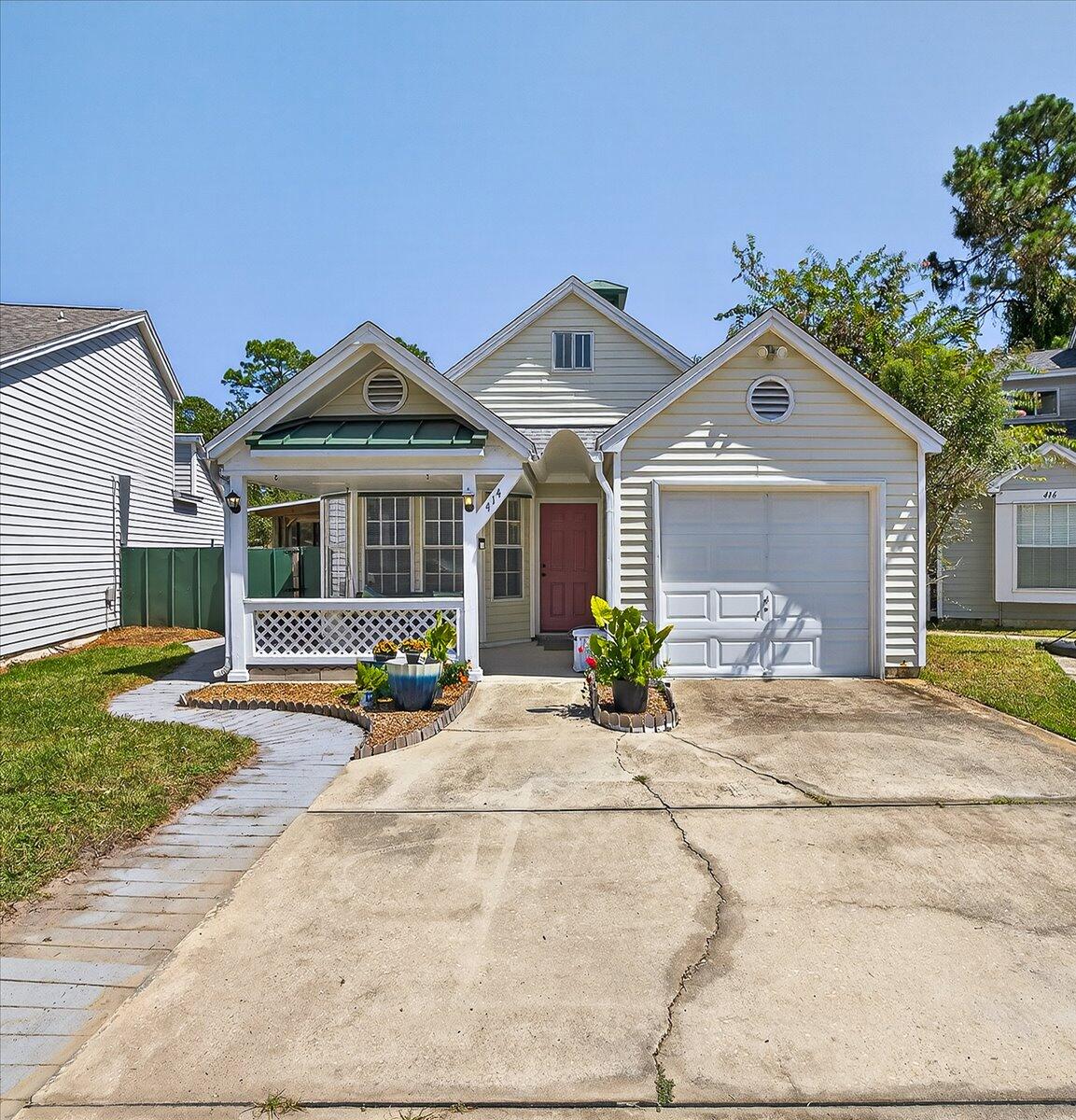 Charming and affordable home in Fort Walton Beach. This home features high ceilings, an open floor plan, and plenty of windows for natural light. There is also a one-car garage, screened porch, and fenced backyard. The kitchen includes a pantry and a small eating bar, perfect for casual meals. The screened porch is ideal for enjoying the Florida lifestyle.