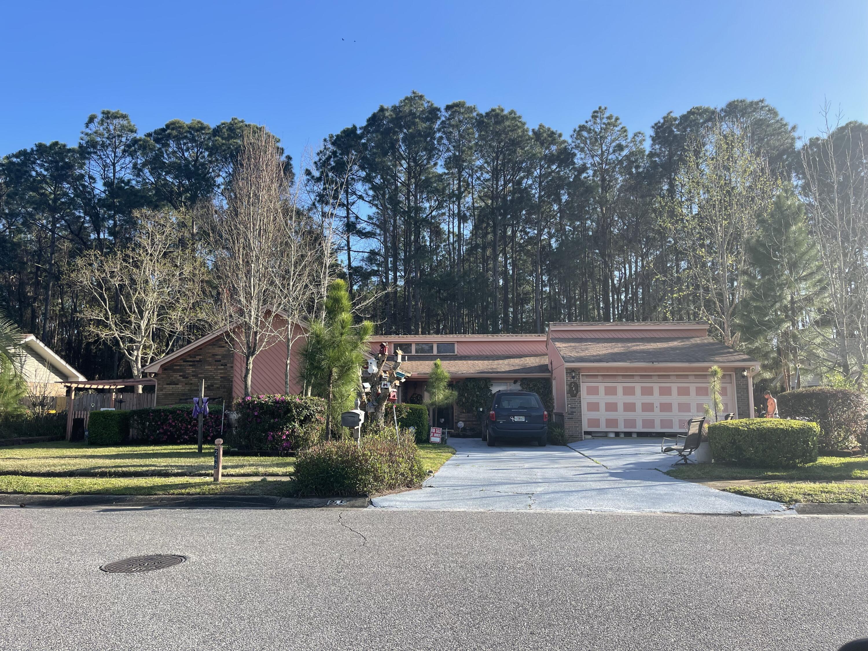 This 3 Bedroom 2 Bathroom home includes a great room and a finished Florida room, plus a two car garage. Two gas fireplaces; one in family room one in great room. The landscaping is professionally cared for both front and back. Behind the garage is an additional dry storage room with seperate access, A free standing shed with front porch sits behnd the house and would make a great workshop or studio. Behind the 9' privacy fence is wooded acreage.Tile floors are found in the main areas and carpet within the bedrooms. The home is being sold AS IS with no repairs. Front roof 2013 and rear Roof 2014. Newer HVAC.