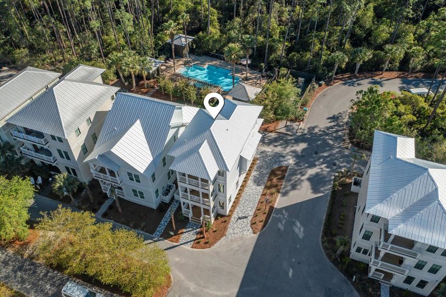 This exquisite 2025 beach cottage in Treetop Village, Inlet Beach, Florida, is a sanctuary of luxury and sophistication, meticulously designed to offer an unparalleled living experience. Featuring high-end finishes that resonate with elegant coastal charm, this home is a testament to refined living. Upon entering, you are greeted by the warm embrace of shiplap walls, engineered hardwood floors that echo the natural beauty of the coast, and raised ceilings accented with crown molding that add an air of luxury. Unique finishes include: designer furnishings and artwork, custom closets throughout the residence, quartzite and ceramic tile, stainless steel appliances, four covered balconies, including a screened outdoor porch overlooking the pool. The sleeping arrangements are thoughtfully planned offering five bedrooms with a potential sixth bunk room to maximize capacity. The first level offers a king bed with an ensuite bath and private entrance, ensuring convenience and privacy. The primary suite, located on the secluded second level, boasts an ensuite luxurious bath and private balcony for moments of reflection or intimate evenings under the stars. The third level of this magnificent home unveils three additional bedrooms, two with king beds and a bunk room with four full beds, designed to accommodate guests in utmost comfort. Balconies extending from four bedrooms offer private outdoor spaces to enjoy the fresh sea breeze and tranquil moments alone or with loved ones. The heart of the home is the open-plan kitchen, equipped with LG stainless steel appliances, quartz countertops, and a generous living and dining area, making it an entertainer's dream. Double-pane windows bathe each room in natural light, creating an inviting and warm atmosphere, while the high-tech air to heat pump ensures this home is not only luxurious but also eco-friendly. Positioned in a gated community near 30A which offers access outside your back door to the deeded beach via tram, inviting you to immerse yourself in the deeded beach access and beauty of the Gulf of Mexico. You are 10 steps to the community pool, a 170' oasis, and an outdoor shower offer a refreshing retreat within the comfort of your enclave. Featuring a gas hookup for grilling, and parking for four vehicles and a golf cart; every detail has been considered for enjoying the Florida lifestyle to the fullest.Beyond the bounds of this retreat, 30Avenue offers shopping, cafes, and amenities to complement your lifestyle. All furnishings, artwork, and housewares convey with the property, ensuring a seamless transition into your new coastal life.

Why choose 171 Redbud over other Treetop homes:
4 parking spots
Downstairs bedroom
6 total potential bedrooms
450 Square Feet of covered porches
Engineered waterproof flooring
Corner location, proximity to pool and tram stop

This beach cottage is not just a home; it's a lifestyle choice that promises serene living, luxurious comforts, and unforgettable moments on 30A