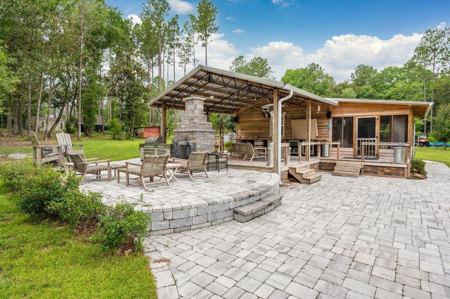 Discover the ideal location with 72.51 +/- acres , a pond, a cabin.Escape to your very own off-the-grid cabin with breathtaking views of a 2-acre lake this cozy one-room cabin features a comfortable bed, a well-equipped kitchen, and a spacious living area, all complemented by a sprawling deck and porch that offer stunning vistas of the picturesque lake. With abundant hardwoods, planted pines, and extensive paved road frontage, this is an exceptional opportunity to own a slice of paradise in this idyllic location. Embrace the tranquility of country living in the heart of Laurel Hill, while still being just minutes away from all essential amenities. Benefit from paved road frontage and convenient access to Hwy 602 and Hwy 85....