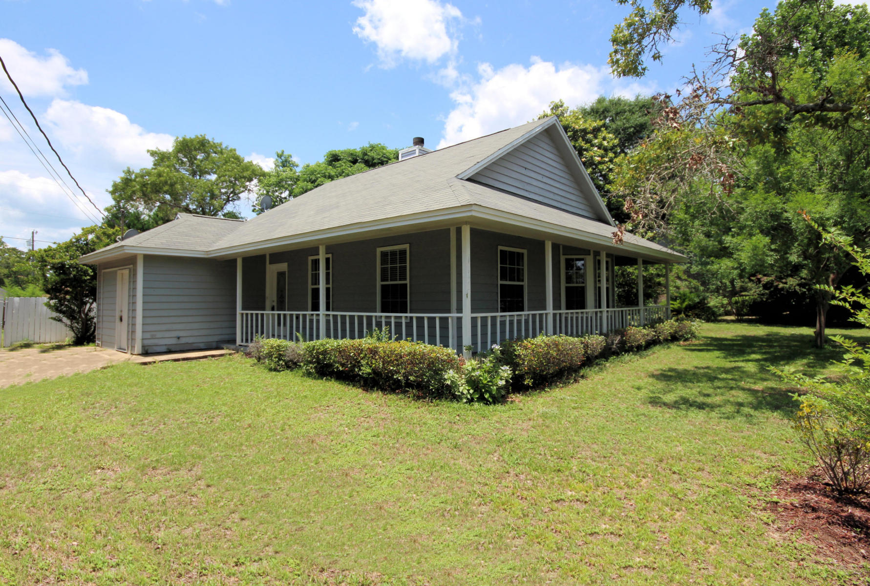 MULTIPLE OFFERS IN PLACE. A LITTLE TLC NEEDED! GREAT STARTER HOME or GREAT INVESTMENT HOME with mature trees and very large lot. This quaint ranch style home with a wrap around front porch and covered Florida room is nicely situated in one of the subdivision's largest lots. This 3BDR/2BA home comes with an added 'in-law's suite' attached to the home through the back covered porch. SOLD AS IS. Schedule your personal tour today!