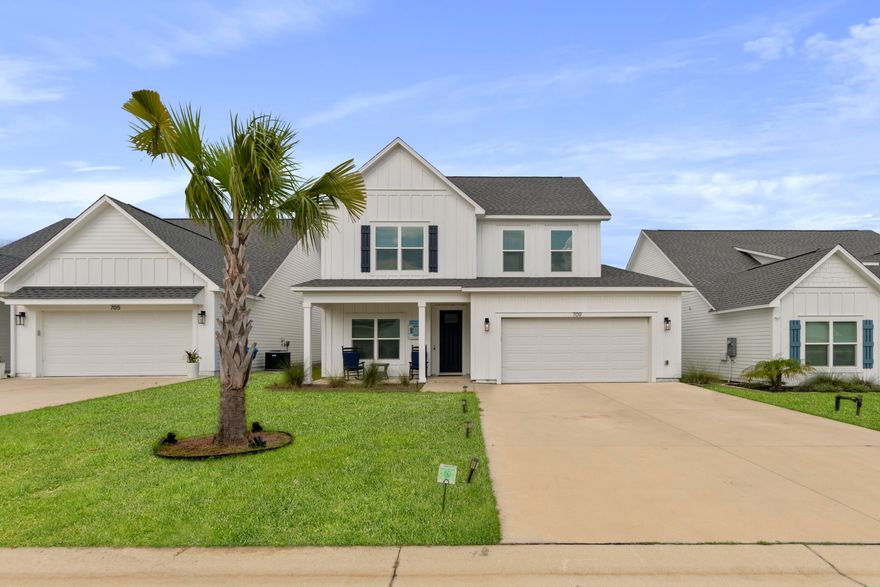 Welcome to this beautifully crafted Craftsman-inspired beach house, blending coastal charm with modern comfort. This thoughtfully designed home features 4 spacious bedrooms, 3 full bathrooms, and a versatile loft area--perfect for families and entertaining.As you enter the home, you're greeted by an open living room area which features raised ceilings, adding an airy and inviting feel when you enter. The kitchen is both stylish and functional, boasting quartz countertops, an oversized walk-in pantry, and a large center island that's perfect for entertaining or casual morning breakfasts. The primary suite offers a peaceful retreat with a frameless tiled walk-in shower featuring a built-in shave shelf. Additionally, you'll find luxury vinyl plank (LVP) flooring throughout the main living areas and the primary suite, with tile in all wet areas and plush carpet in the upstairs guest bedrooms. Also, cottage-style trim and LED lighting throughout the home bring warmth and character to every space. An additional bedroom downstairs is great for an office or Mother-in-law suite. 

Upstairs, you'll find two generously sized guest bedrooms located just off the loft, which makes a great space for a home theater, playroom, or additional living area. 
Additional features include impact-resistant windows and doors throughout. A spacious fenced in backyard is perfect for barbecues or a space for the kids and dogs to play. 

**The home is being sold unfurnished, certain furnishings can be included with the right offer.** 

Home is walking distance to the Lake Powell Boat launch where you can launch a boat, kayak or paddle board! This home effortlessly combines timeless design, functional space, and high-quality finishes ready for you to move in and make it your own!

