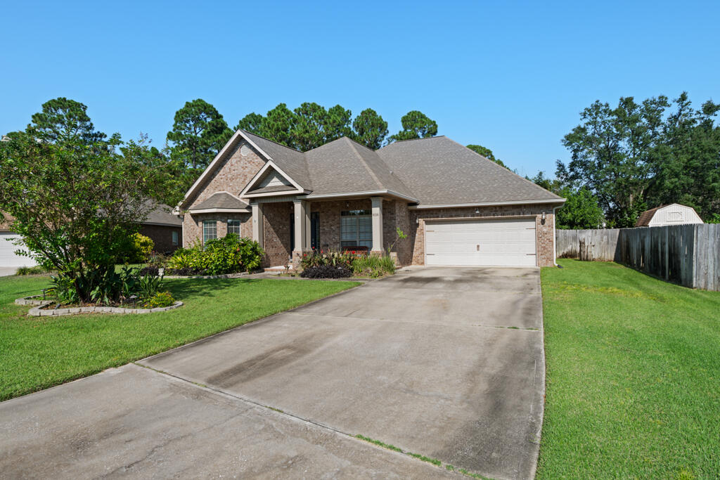 Welcome to this beautiful split floor plan, 5 bedroom, 3 full bathroom home in Summerset Estates! Situated on over half an acre and extending beyond the fence line in the back, it's one of the largest lots in the neighborhood. Excellent curb appeal with thoughtful landscaping that continues into the large, fully fenced in backyard. The large sweeping driveway leads to a 2 car garage with hallway entry. Featuring a chef's kitchen with walk in pantry, stainless steel appliances, granite countertops, island, and a breakfast bar. The living room has a built in wall length bar with granite countertop and an electric fireplace. Just off the great room, with its own wing, is the primary bedroom with large ensuite featuring a double vanity, walk in shower, garden tub, and a large walk in closet. The 4 additional bedrooms are evenly split across the home, with 2 bedrooms and a bathroom towards the north side, and the other 2 bedrooms and bathroom on the south side by the kitchen and breakfast nook. This Gulf Breeze home is centrally located between the beaches of Navarre and Pensacola, and the local military bases! With easy access to Destin, Fort Walton, Navarre, Gulf Breeze, Pensacola, and Milton!