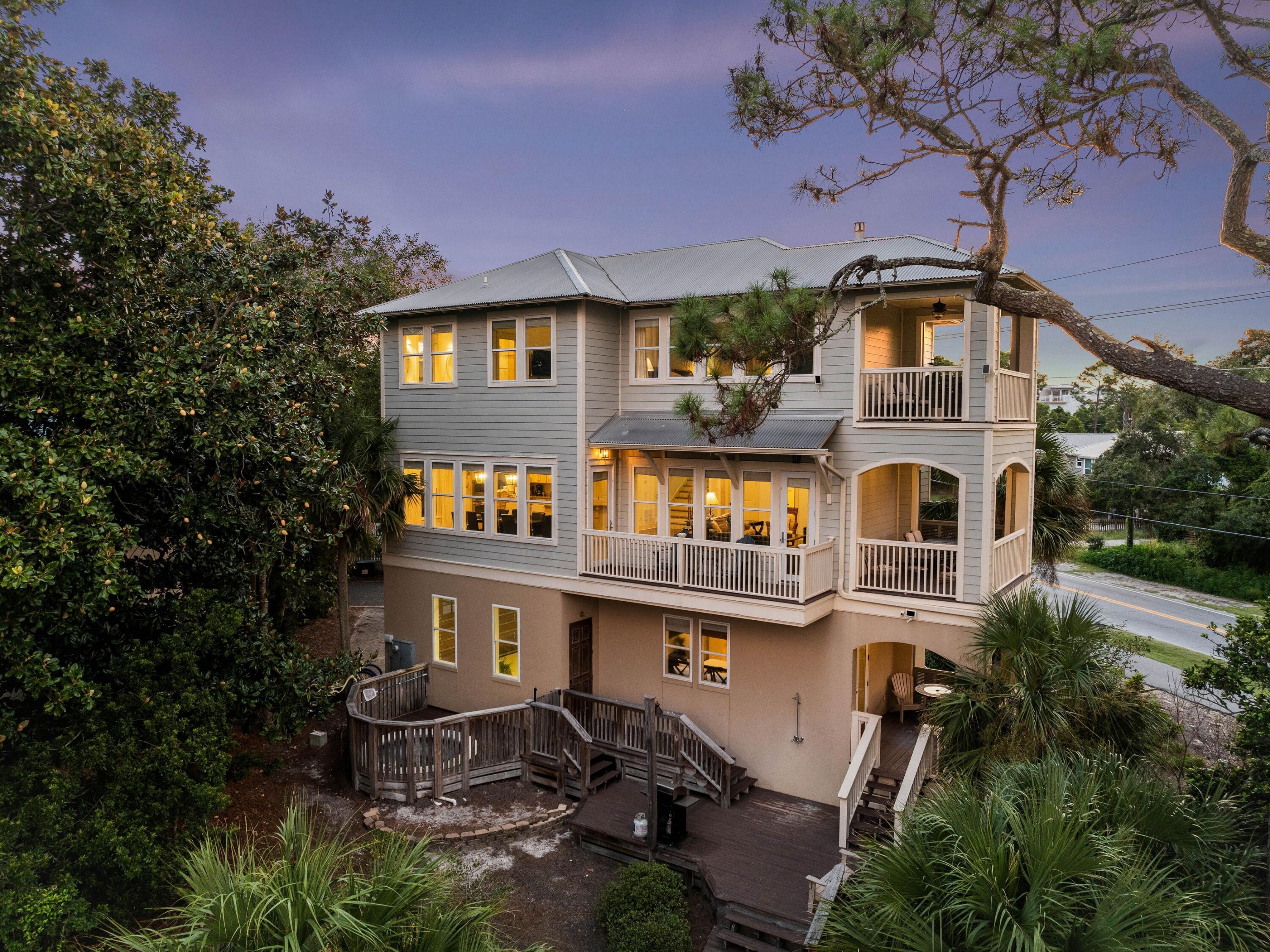 INVESTMENT OPPORTUNITY w/PRIVATE BEACH ACCESS.  Perfectly located in an exclusive community south of 30A, this residence is steps from the boardwalk that winds through the trees to the beach. Spread over three floors, the home was custom-built to the highest specifications by Davis Dunn Construction. Quality workmanship and materials are showcased in the high ceilings, crown molding, gorgeous stone and hardwood flooring, two luxurious master suites, travertine bathrooms and an elevator connecting all floors. The outdoor deck is perfect for soaking in the in-ground hot tub while socializing with guests, or perhaps gazing quietly at the stars after dark. Multiple balconies and porches offer a plethora of outdoor living spaces with wonderful views of the lush landscaping and shimmering Gulf.