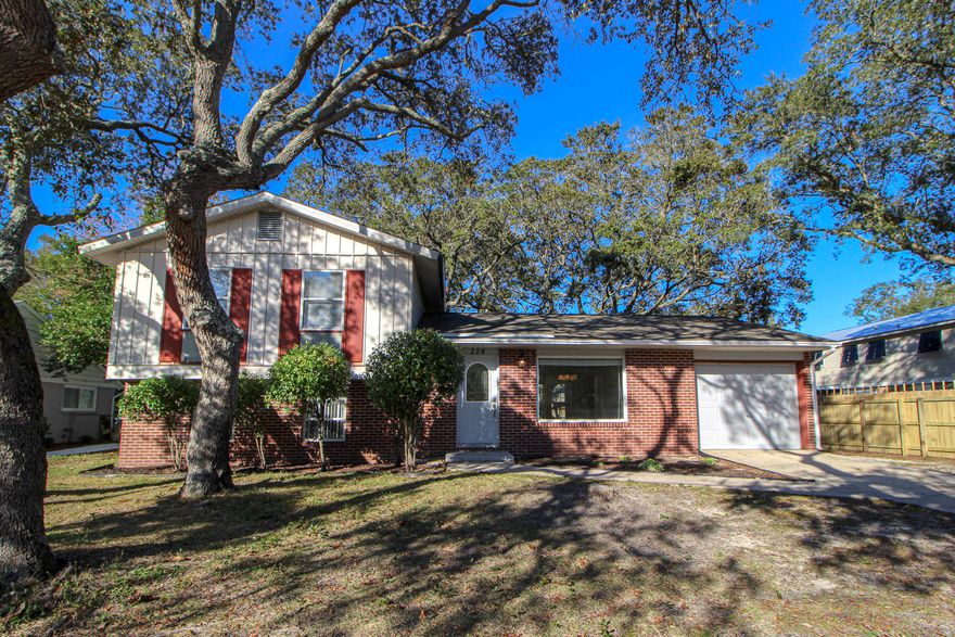 Amazing LOCATION and a chance to add your own touches with some minimal work! Wonderful family home situated on a large lot in the desirable Bayou Woods neighborhood. Spacious living room with large tile flooring and picture window with custom wooden valance. Dining area has tile flooring, chair railing and French doors that lead out to the deck and backyard. Kitchen has beautiful granite tile counter tops, designer lighting, upgraded stainless/black appliances, nice tile backsplash, wainscoting accent wall and a large window over the sink overlooking the backyard. Upstairs is the master bedroom with double closets and a private entrance to a renovated full bath. Full bath has a large vanity, water saver toilet and a window over the bath/shower for nature light. Two additional bedrooms are located upstairs on the front of the house, with good size closets.  Downstairs is a great room for entertaining with plenty of space for lounging and relaxing with the family.  There is a second full bath downstairs with stand up shower and the laundry room is just beyond the bathroom with plenty of room for storing cleaning supplies and folding clothes on the counter tops of the cabinets.  This property could use a little love and care and this house would make a beautiful family home nestled among the live oak trees in the middle of Fort Walton Beach.  If you're handy and don't mind some minor work, this is the place for you!!