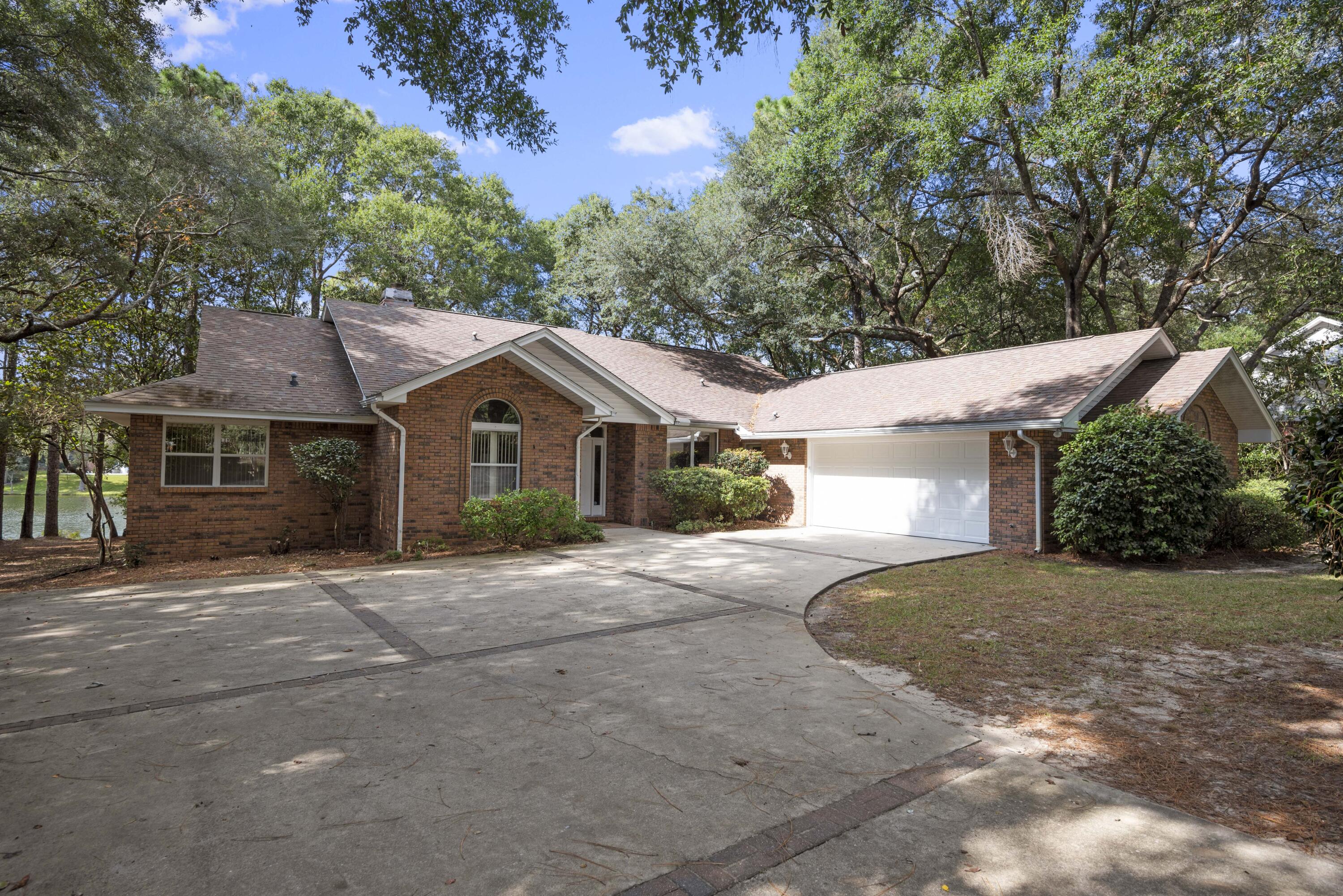 Lake Front Home In The Highly Sought After Rocky Bayou Country Club Estates! Hurry This Home Won't Last Long... Diamond In The Rough! Largest Lot On The Lake!!! This Home Features 3 Spacious Bedrooms, 2 1/2 Bathrooms, Fully Applianced Kitchen And Home Office With Built In Bookshelves. Living Room & Dining Room With Beautiful Hardwood Floors, Family Rooms Has A Wall Of Windows Showcasing Panoramic Lake Views. Newer HVAC 2-3 Years, Generator 2017, New Garage Door, Roof Approx. 6 Years. This Is An Estate Sale & Will Be Sold As Is.