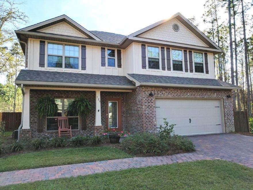 One of the largest homes in this subdivision. Private and quiet subdivision with privacy on west and back of property. Fenced in yard with natural surroundings. This spacious home has so many upgrades, such as crown molding, granite counter tops, glass back splash and extra bonus room with large two car garage. Large Master Bedroom on first floor with walk in closet and wooden shelving in closets. Master Bath has a large shower and double vanity. Extra family room on second floor with two more full baths and three bedrooms. Make this your home with a convenient location to the beach or the bay.