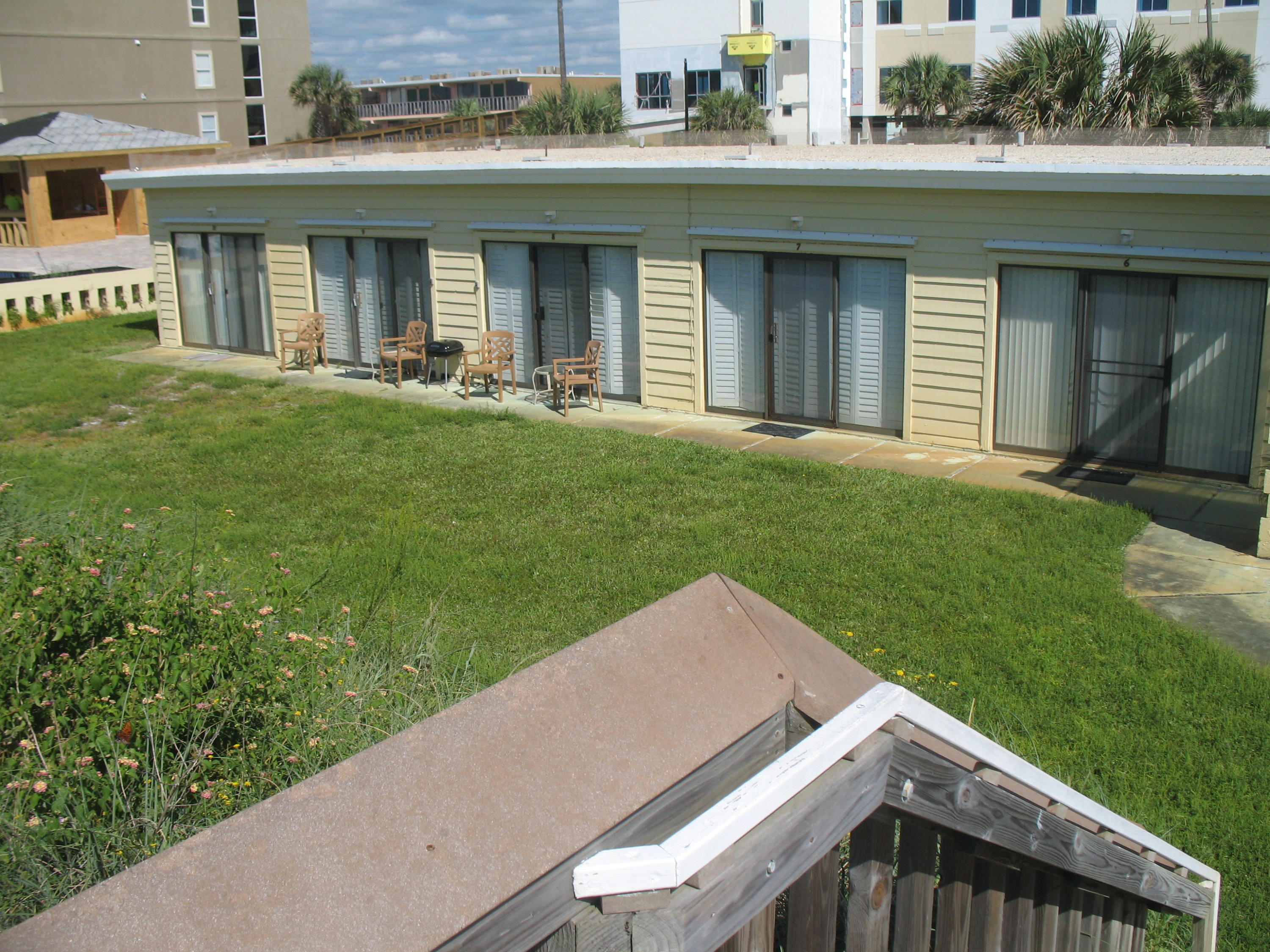 The perfect hideaway. Tucked behind the sugar white, sea oat filled sand dunes of the Emerald Coast, this bungalow is the perfect getaway!!! Beautiful natural solid wood walls, murphy bed, bathroom, and kitchen are all you need to enjoy a true vacation hideout. A unique opportunity to purchase into this 10 unit cooperative. Each owner is issued a share of stock in the corporation. A true one of a kind find!!!
