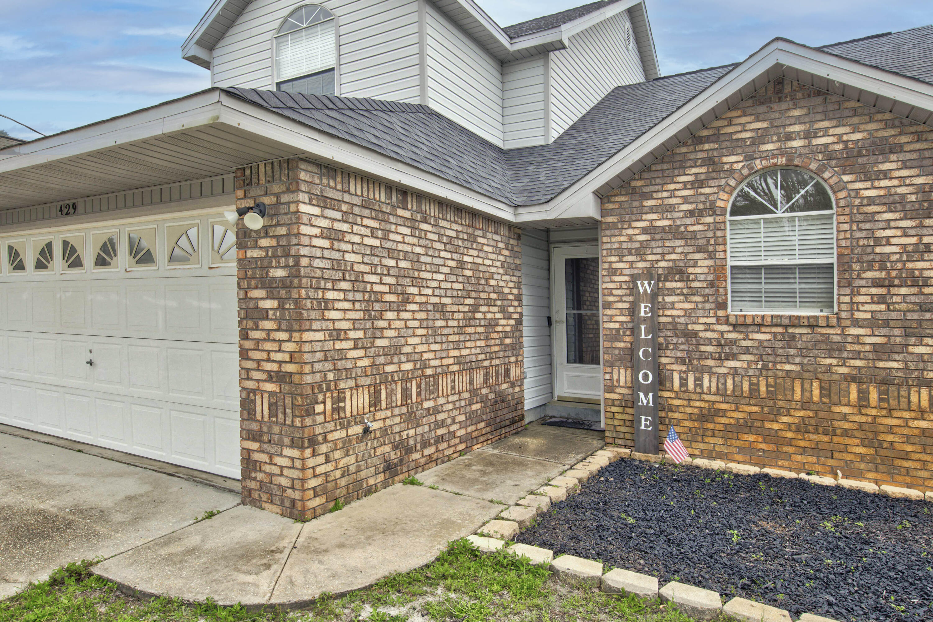3 BEDROOM 2 1/2 BATH IN NAVARRE!! Step inside to discover all this property has to offer. The main living area features a wood burning fireplace with a modern white stone frame, cathedral ceilings and two windows in addition to the sliding glass door brining in an abundance of natural light. The kitchen offers plenty of counter and cabinet space and an eat-in dining area. The master bedroom rests on the first floor with a private en-suite. The master bathroom features a separate shower and tub and double vanity. Upstairs are the two additional bedrooms and bathroom. Spend your days enjoying the open deck in the privacy of your fenced in backyard or inside by the fire. Schedule your showing today and let us welcome you home!