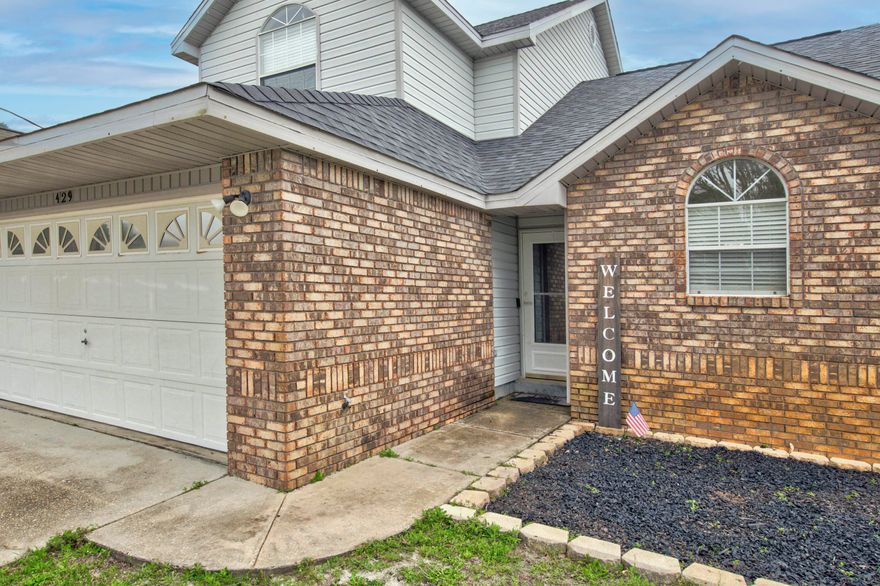 3 BEDROOM 2 1/2 BATH IN NAVARRE!! Step inside to discover all this property has to offer. The main living area features a wood burning fireplace with a modern white stone frame, cathedral ceilings and two windows in addition to the sliding glass door brining in an abundance of natural light. The kitchen offers plenty of counter and cabinet space and an eat-in dining area. The master bedroom rests on the first floor with a private en-suite. The master bathroom features a separate shower and tub and double vanity. Upstairs are the two additional bedrooms and bathroom. Spend your days enjoying the open deck in the privacy of your fenced in backyard or inside by the fire. Schedule your showing today and let us welcome you home!