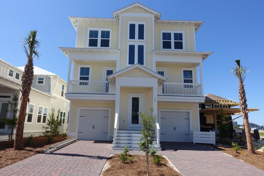 Welcome to the newest phase in Prominence. This is the Cape floor plan. This home is being constructed withHardiPlank, Metal roof and vinyl impact resistant windows. As you drive up to this home you find a brick paver driveway. There are two separate garages for this home. The porches have ceilingfans and can lighting fixtures. The ground level of this home has a nice foyer and a flex space that could be used as a home theater room or game room, there is also a full bath with a shower only. The interior of this home has Hardwood floors incommon areas, upstairs hallway and bedrooms., tile in the wet areas, smooth finish ceilings, brushed nickel hardware andbeautiful interior 8' doors.