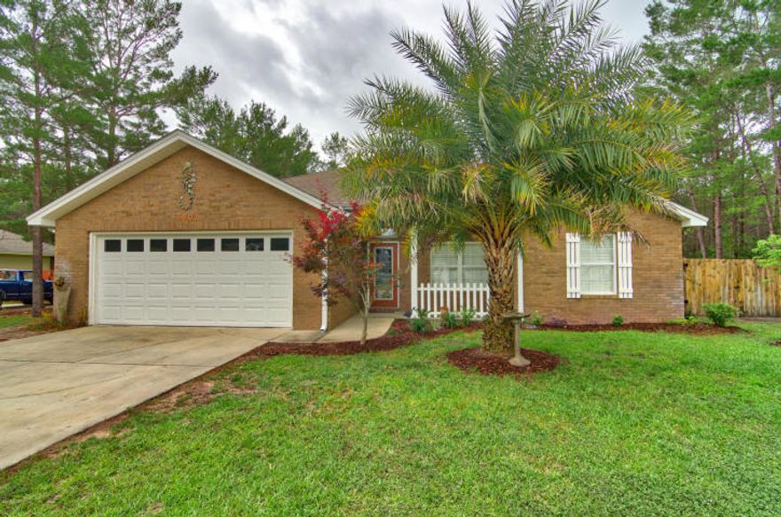 From the moment you enter this beautiful home you feel at Home! This Single Story, Spacious, Clean, Split floor-plan in Mint condition is waiting for you. Kitchen has custom cabinets, stainless steel appliances and upgraded modern lighting fixtures. Ceiling fans with lighting and remote controls. Master suite with Jacuzzi tub, all rooms have plantation shutters, front and backyard landscaping with oversized screened in porch. All 4 bedrooms have ample closet space. Heating and cooling unit in the finished double car garage. Detached workshop also with heating and cooling system. Great curb appeal. Home ready to move in. Call your Realtor to schedule a showing today