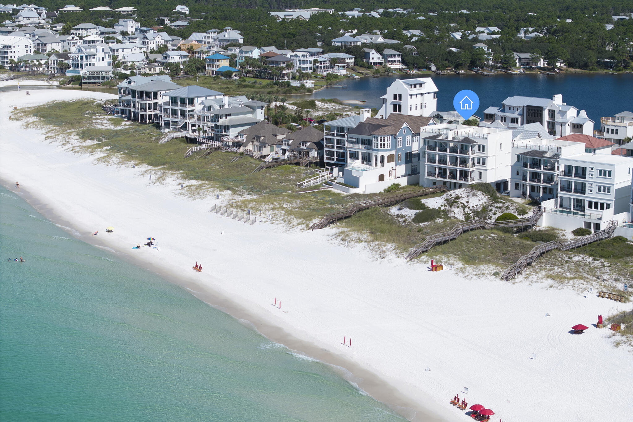 Welcome to Azzurro, a name that translates to ''blue'' in Italian, perfectly capturing the crystal blue waters of the Emerald Coast just beyond your doorstep. This extraordinary 4-bedroom, 4,272 sq. ft. Gulf-front residence redefines coastal luxury with 109 feet of pristine beach frontage, a private dune walkover, and a rooftop pool offering panoramic views. Set on nearly an acre, this rare offering combines architectural brilliance, premier finishes, and first-class amenities in one of 30A's most coveted locations. Masterfully designed by Eric Craig of B. Design, every detail reflects thoughtful craftsmanship and refined elegance. Soaring 9-10' ceilings, porcelain wood-look tile, spruce ceilings, custom mosaics, and designer lighting create a seamless flow throughout. Impact-rated glass, ICF construction, superior insulation, multiple SEER 18 HVAC units with dehumidifiers, tankless gas water heating, and smart-home technology ensure both security and efficiency. The crisp white fa??ade, paver drive, and 3-car garage with additional parking complete the home's striking curb appeal.
The first level is designed for entertainment, offering a spacious game room with wet bar and full bath, ideal for easy access after a day on the beach. A private elevator services all four floors, leading to multiple Gulf-front living areas and balconies that invite endless views and natural light. At the top, the spectacular rooftop retreat features a stainless steel pool with mosaic-tiled steps, a paver sun deck, and a tempered-glass surround that maximizes breathtaking panoramas.
The heart of the home is found on the second floor, where the kitchen, dining, and great room blend seamlessly in an open-concept layout framed by floor-to-ceiling glass. A coffered ceiling, LED fireplace, and custom furnishings by Lisa Hunter Interiors elevate the space. The chef's kitchen is a showcase of form and function, boasting Sub-Zero refrigeration, a Wolf 8-burner dual-fuel range with griddle, wine cooler, soft-close cabinetry, and a designer backsplash.
The third floor hosts two Gulf-front bedroom suites with direct balcony access, complemented by a fantastic flex space with wet bar. Each suite features a spa-inspired bath with custom tile, Quartz vanities, and walk-in showers.
The top floor is reserved for the primary suite, an oasis of sophistication with a freestanding soaking tub, walk-in shower, dual vanity, expansive walk-in closet, and sweeping Gulf views. An additional Gulf-front guest suite with private bath and a full pool bath complete this level, ensuring both luxury and privacy for family and guests.
Sold fully furnished and professionally decorated, Azzurro is truly turnkey. Smart-home systems allow owners to manage climate, security, pool, and garage features with ease from anywhere in the world. Nestled on a private palm-lined paver street shared by only three Gulf-front homes and this exclusive condominium, the residence balances privacy with convenience. Ideally located in Seagrove, just minutes from Seaside, Alys, and Rosemary Beach, residents enjoy instant access to fine dining, boutique shopping, rare coastal dune lakes, and scenic state parks. Local favorites like Old Florida Fish House, Buddy's Seafood Market, and Beachy Bean Coffee are just a short bike ride away. Blending timeless elegance with modern innovation, Azzurro is more than a home, it is a Gulf-front sanctuary designed for those who expect the very best.