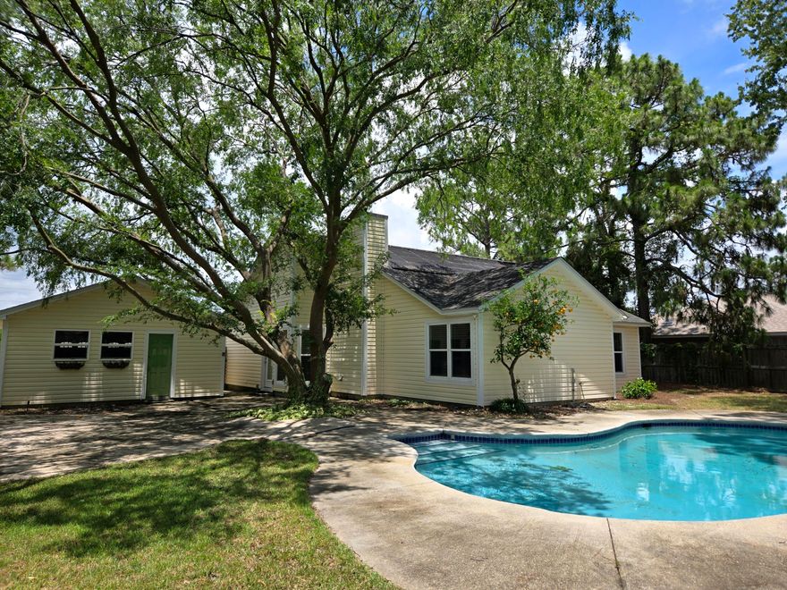 Welcome to your own slice of paradise! This beautifully updated 3-bedroom, 2-bath home checks all the boxes--with a private saltwater gunite pool, detached 2-car garage, and no HOA, all just minutes from shopping and the white sands of Navarre Beach.Inside, you'll find a light-filled open concept layout with vaulted ceilings, crown molding, and wainscoting in the living room, adding charm and character throughout. A cozy wood-burning fireplace serves as the heart of the living area. The eat-in kitchen features granite countertops, a stylish tile backsplash, a movable island, and a breakfast bar, ideal for entertaining or family meals. The primary suite is a true retreat with a trey ceiling, bold accent wall, and a spacious bath featuring a garden tub/shower combo. Both guest bedrooms include chair rails for added design detail. New luxury vinyl plank flooring flows throughout the home, complemented by newer windows and a brand new HVAC for year-round comfort.

Step outside to your oversized back patio, perfect for outdoor dining or lounging by the saltwater poolcomplete with a brand new pump. A separate shed offers convenient storage, and the fenced backyard is ideal for pets or play.

Located in a sidewalk-lined neighborhood with streetlights and shopping less than a mile away, this home combines convenience, style, and relaxation. And with Navarre Beach just under 5 miles away, you'll be living the coastal lifestyle in no time.

Schedule your tour todaythis one won't last!