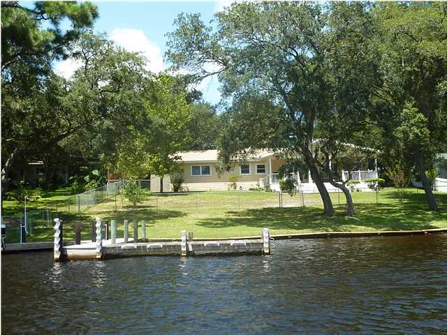 BEAUTIFUL, UPDATED WATERFRONT HOME! ALMOST HALF AN ACRE ON CINCO BAYOU - DEEP WATER! 100' ON THE WATER WITH SEAWALL, DOCK AND BOAT SLIP. ENJOY THE WATER VIEW ON THE LOVELY COVERED PORCH THAT IS TILED AND HAS SKYLIGHTS. LOTS OF LIVING SPACE WITH A GREAT ROOM AND LIVING ROOM. KITCHEN FEATURES NEW CABINETS, GRANITE COUNTERS, BUILT IN MICROWAVE, STAINLESS STEEL GAS STOVE, PANTRY, BREAKFAST BAR. DINING ROOM. MASTER SUITE FEATURES DUAL WALK-IN CLOSETS, A BATH WITH DUAL VANITIES, GRANITE COUNTER. THREE ADDITIONAL, GOOD-SIZED BEDROOMS. FULL BATH. 2-CAR GARAGE. LAWN PUMP AND SPRINKLER SYSTEM. RV HOOK-UP ON SIDE OF HOME. NEW PLUMBING INSIDE AND OUT!
