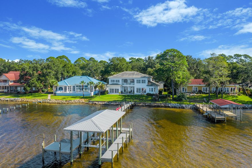Bay front living at its best. This beautiful, recently renovated home maximizes the benefits of waterfront living with its thoughtful floor plan and a new dock and boathouse. With a master bedroom on each  floor, both are perfect for taking advantage of the location. Upon walking through the front door you are immediately greeted with the expansive sunset views of the bay. On the first floor, the kitchen, living, master, and breakfast area all take advantage of the bay front location. Upstairs you will find another master bedroom as well as two more bedrooms sharing an updated jack-and-jill bathroom. Additionally, there is an upstairs porch accessible from the master and a guest bedroom. The spacious three car garage also has room for a golf cart.Additional features include: