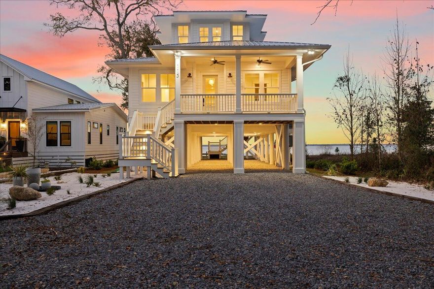 Welcome to 115 Native Tree--where classic Florida cottage charm meets modern sophistication. Perched on pilings in a nod to Old Florida's timeless design, this home is elevated to capture breathtaking bay views while offering future possibilities for its new owners. Whether you envision a garage, additional parking, or racks for your surfboards and paddleboards, the raised foundation provides flexibility for your coastal lifestyle or just enjoy the stunning bay views.  Inside, the warmth of white oak flooring flows throughout, leading you to an open-concept living space where the custom designer kitchen with Thor appliances overlooks the bay and seamlessly connects to an expansive rear porch--perfect for taking in those iconic waterfront sunsets.With four bedrooms and four baths this home exudes effortless style, infused with a subtle Australian-inspired flair. The custom all-oak staircase is a true masterpiece, anchoring the home's impeccable craftsmanship. Every bathroom features designer tile and quartz countertops, creating a luxurious yet inviting atmosphere.

Every detail has been thoughtfully curated, from the professionally landscaped grounds to the lighted steps and irrigation system. 115 Native Tree is more than a homeit's a work of art designed for those who appreciate classic beauty with modern comfort.

For a private tour, contact the listing agent today. 

