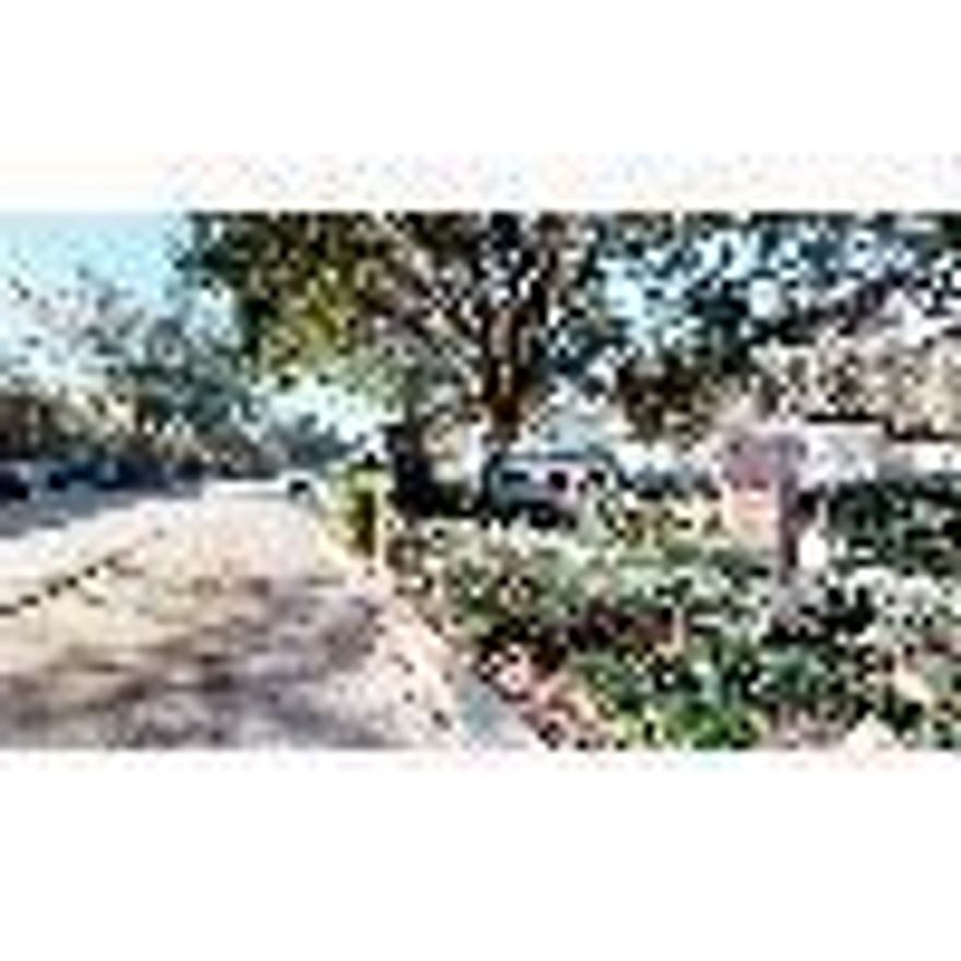 This first-floor unit offers added privacy and convenience. Enjoy a private, covered patio with additional storage, perfect for relaxing or extra space. The home features a dining and living area combination, a spacious laundry room, and ceramic tile and carpet flooring throughout. The spare bedroom includes private access to a full bath, while the master suite boasts a walk-in closet and an ensuite master bath. Pest control and lawn service are included for your convenience. No pets allowed.