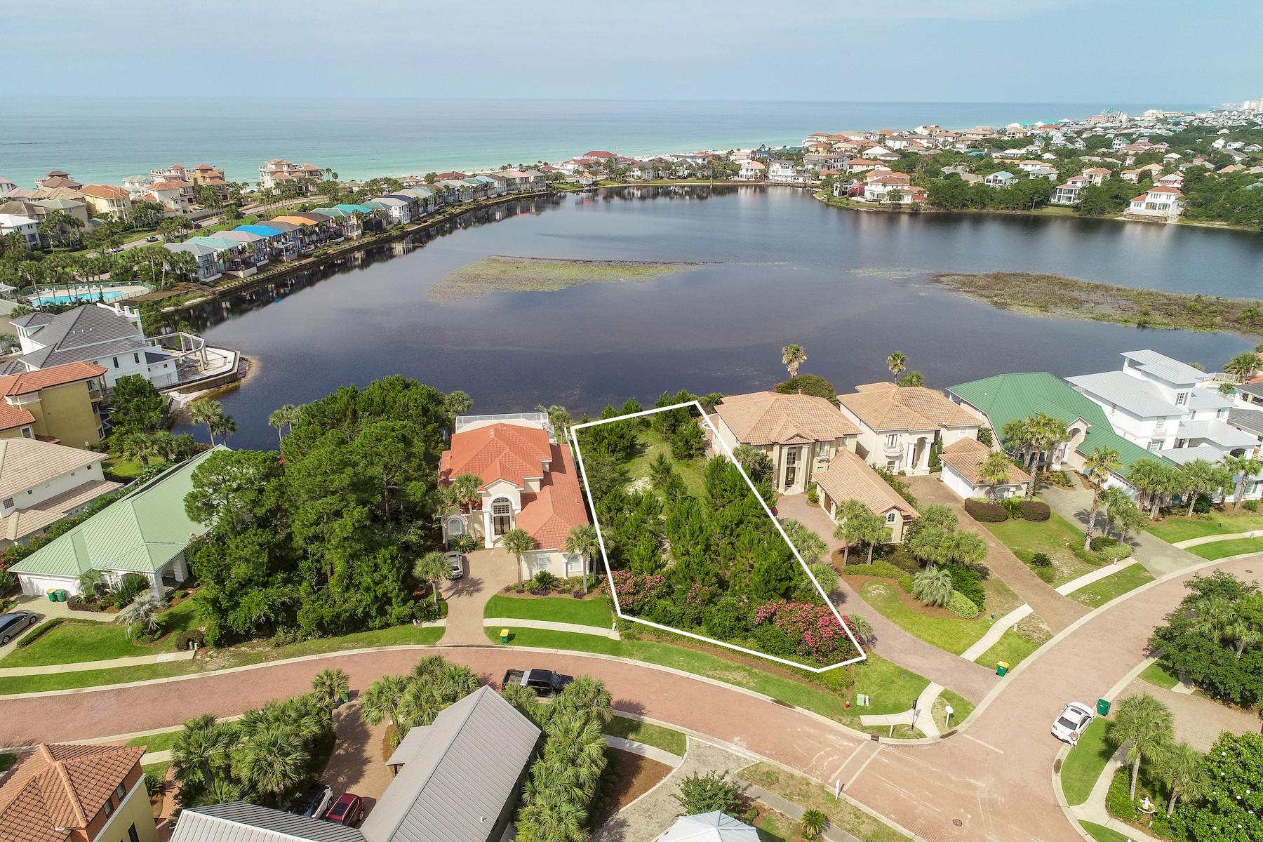 Pristine lake vistas and prominent positioning behind the gates of prestigious Destiny East define this exceptional 60'X225' lake front building site representing one of the largest single family home sites to come available in the Destiny Communities. This exemplary location yields prominent southwestern views of the Gulf of Mexico and Four Prong Lake as well as convenient beach access from the south gates of Destiny East. There is ample space to build a dream home while enjoying an exclusive central location close to world class shopping, golf courses, casual and fine dining as well as local entertainment.