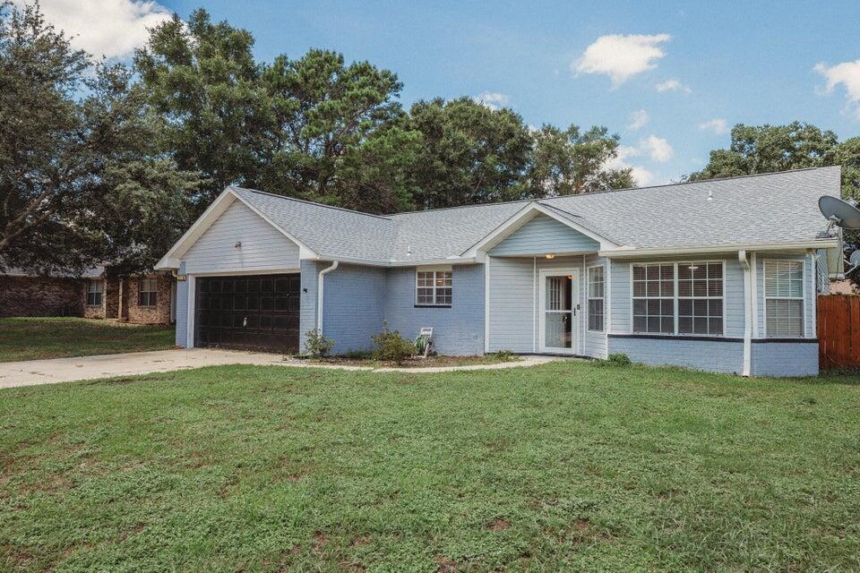 This charming 3/2 home with a large office/flex room checks all the boxes! The home is situated in an established community with mature shade trees on a cul-de-sac offering a relaxed neighborly setting with no through traffic. Inside you will find a well thought out split floor plan with a spacious open living area with a vaulted ceiling and wood flooring. The backyard offers plenty of space to entertain or stay cool under the large covered patio. The roof was replaced in 2020. To view, come by Navarre Beach Realty at 8666 Navarre Parkway in the Winn Dixie Shopping Center and check out the keys. We just need a copy of your driver's license. Office hours are Monday through Friday 9am-5pm. Keys must be returned to the office by 5pm. Pets are allowed.