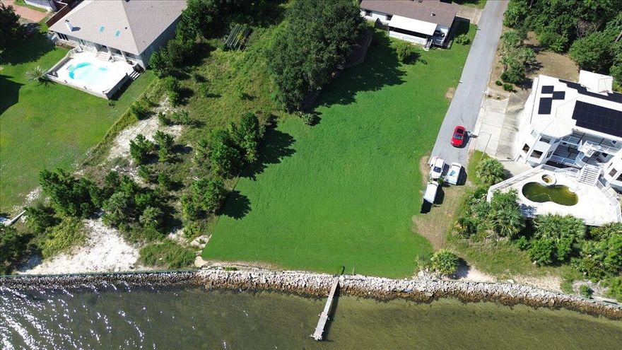 SELLER TO CONTRIBUTE $10K TOWARDS BUYER CLOSING COSTS OR TEAR DOWN TO START A NEW BUILD! Nestled on a waterfront lot this property offers the perfect opportunity to bring your vision to life. Currently home to an as-is single family residence, the true value lies in the blank canvas awaiting your dream build. Whether you envision a custom estate, a modern farmhouse or a peaceful retreat surrounded by nature, this address is where future plans take root. Enjoy the freedom with no HOA to design a home that fits your lifestyle while enjoying 100 feet of waterfront potential. Imagine morning coffee with these water views or sunset gatherings with friends and family. Boating, kayaking and paddle boarding right out your door, you might even see dolphins and sea turtles! Conveniently located off of HWY 98 close to shops, dining, schools, hospitals, gyms and pristine sandy beaches. Navarre Beach is within minutes. You have sound and Gulf views, perfect to catch the Blue Angels. The 1983 single family residence is being sold AS IS. The home is livable, yet the intention is to sell the land with the potential it offers future buyer/s. We have tear down quotes ranging from $8500-$10k, dock estimate and insurance/flood quotes. Have peace of mind knowing we also work with several builders experienced in waterfront living. We'd love to make your coastal dreams come true!
Please see the document section for floor plan examples and supporting docs. We tried to supply as much information as possible to help with the process.