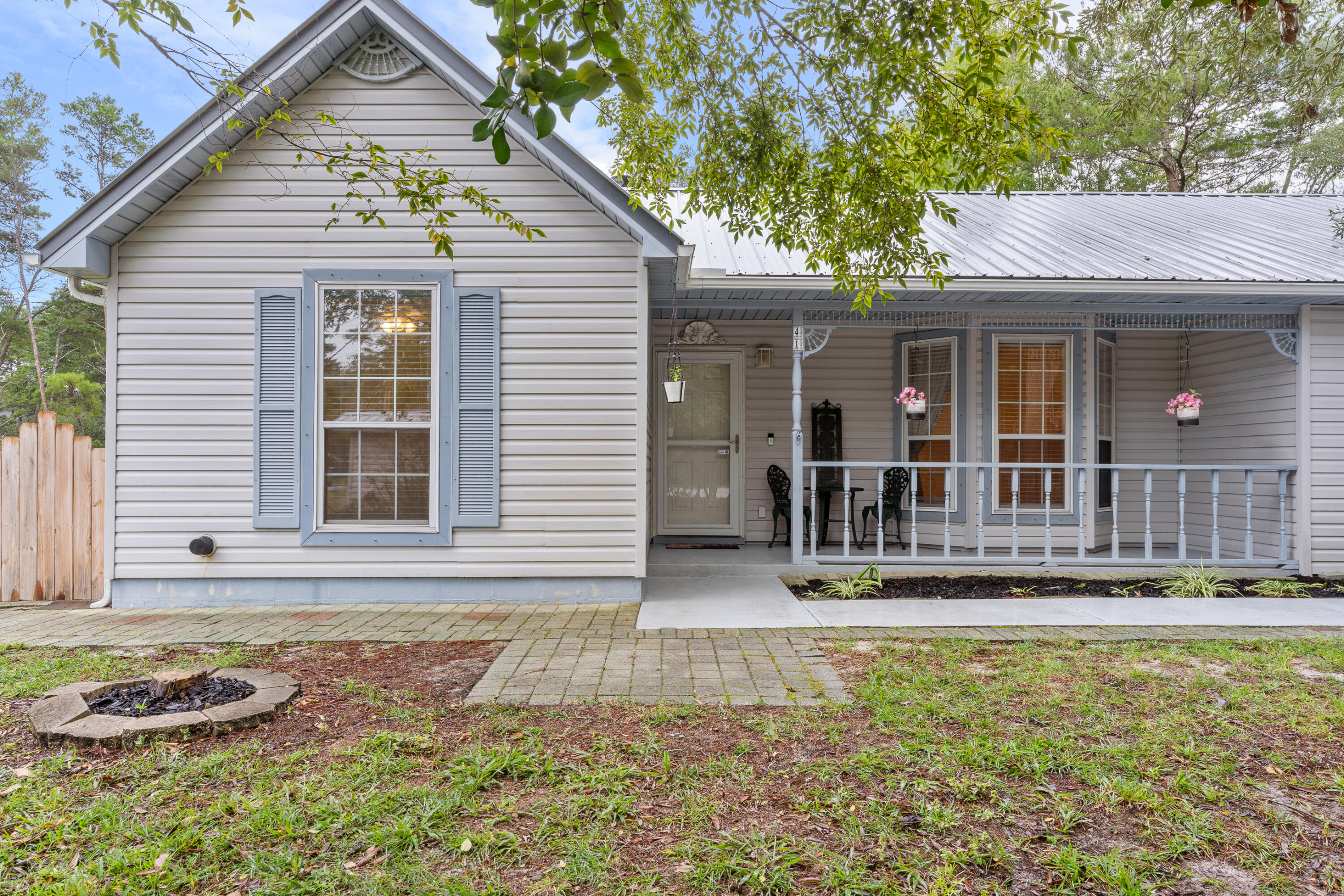 Beautiful mature trees create a tranquil setting for this one story home in the heart of Santa Rosa Beach.  With over a half acre of land, the outdoor space offers amazing possibilities.  This home has an enclosed sun room, oversize two car garage, updated flooring and appliances.  Multiple areas around the home would be ideal for entertaining patios and decks, gardens, pet areas and more.