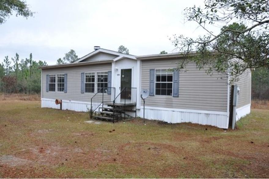 REO property. This mobile home has a lot to offer and sits on just over two acres of land! Home features 1,296 square feet of living space, three bedrooms, two full bathrooms, and a nice fireplace in the living room. The kitchen provides ample space for cooking and dining, and provides a breakfast bar as well. Buyer to verify measurements.