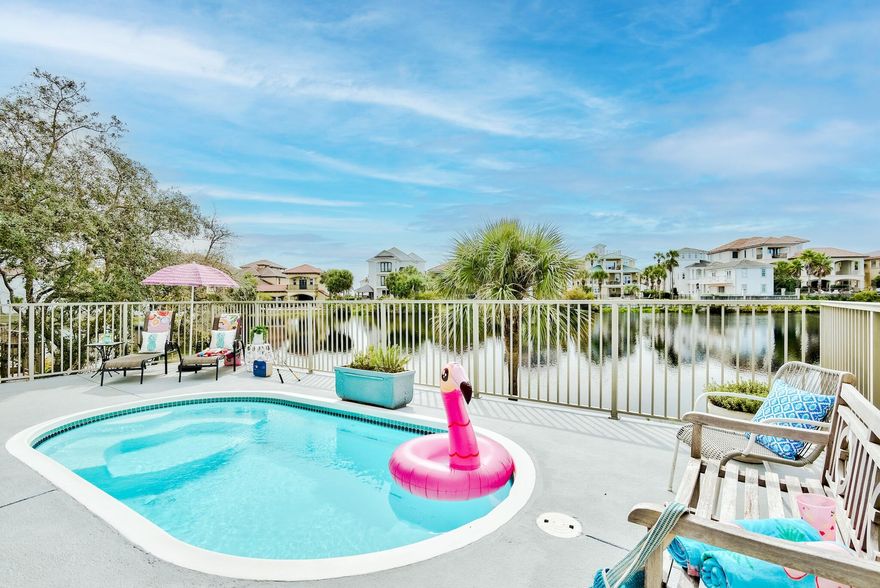 Located within one of the most sought-after Destin communities is this beautiful lakefront home + saltwater splash pool in the gated Destiny neighborhood. Would be an incredible primary or secondary residence, or this home is sure to be a huge rental income producer with 3 full bedrooms, a potential bunk alcove, and widow's watch on the top floor with a daybed, kitchenette, and Gulf views. Large living room with fireplace and built-ins newly remodeled gourmet kitchen with professional grade appliances, sleek stone counters, and new white shaker cabinetry. A grand master suite on the first floor with pool access and water views and a large fully remodeled master bathroom with separate shower, freestanding soaking tub, and walk-in closet. The home has a 2 car garage and driveway allowing ample parking.

Recent upgrades include:
*photography will be updated with new updates soon!
- 2 new HVAC units installed 3/25 for over $12,000 with warranty
- Roof replaced in 2017 with top grade materials
- 2nd floor has all new carpet and stairs are now wood
- Newly renovated kitchen with all new cabinetry, appliances, counters, and lighting
- Updated wood look tile floors throughout the entire main living level
- Newly remodeled master bathroom with beautifully tiled walk-in shower, separate soaking tub and double vanities plus a HUGE walk-in closet
- New full bath addition on main level with walk-in shower featuring beautiful tile
