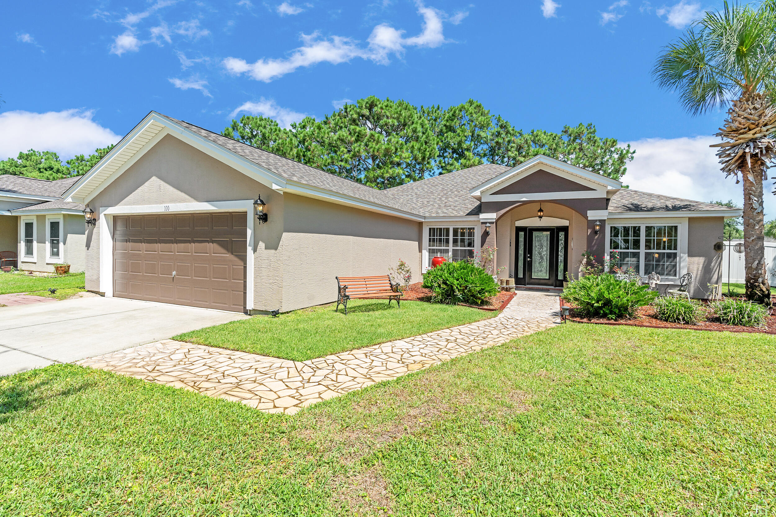**3.625% ASSUMABLE VA LOAN** This beautifully updated home is exceptionally maintained, move-in ready, and packed with thoughtful upgrades. Situated on a spacious .34-acre corner lot in Palmetto Trace, you're just minutes from Pier Park, Frank Brown Park, and the white sand beaches of Panama City Beach. Inside, you'll find 2,351 square feet of living space with a smart split-bedroom layout that offers both comfort and privacy. The primary suite features a large walk-in closet with built-in armoire, a garden tub, separate walk-in shower, bidet toilet, water closet, and generous linen storage. Across the home, two guest bedrooms share a full bath. Two versatile bonus rooms upfront offer endless possibilities - use them as home offices, play or media rooms, or extra guest quarters. The open-concept family room connects to the kitchen and breakfast area, all freshly painted in 2025 and designed for everyday ease and entertaining alike. The kitchen features under-cabinet lighting that brightens prep space and adds a modern touch, while a hidden outlet behind the family room TV and under the couch keeps cords tucked away. Crown moulding adds a polished finish throughout. Step outside to a fully fenced backyard oasis - professionally landscaped in 2025 and enclosed with a newer vinyl privacy fence (2023). The coated sandstone patio features three new fan/light fixtures, a hot/cold outdoor shower, and is already wired for cable and plumbed for gas, making it easy to add your dream outdoor kitchen. Additional updates include a new roof (2024) and new Trane HVAC system (2024). The oversized two-car garage is a true standout with epoxy flooring, multiple storage closets, a dedicated closet for hurricane shutters and the water heater, plus pull-down stairs leading to a large, walkable attic. Located in the golf cart-friendly community of Palmetto Trace, this home sits on a premier corner lot just across from the community pool. With low quarterly HOA dues, sidewalks, pet-friendly walking areas, and access to two resort-style pools, you can truly enjoy the best of coastal living - without ever needing to start the car. See it for yourself today!