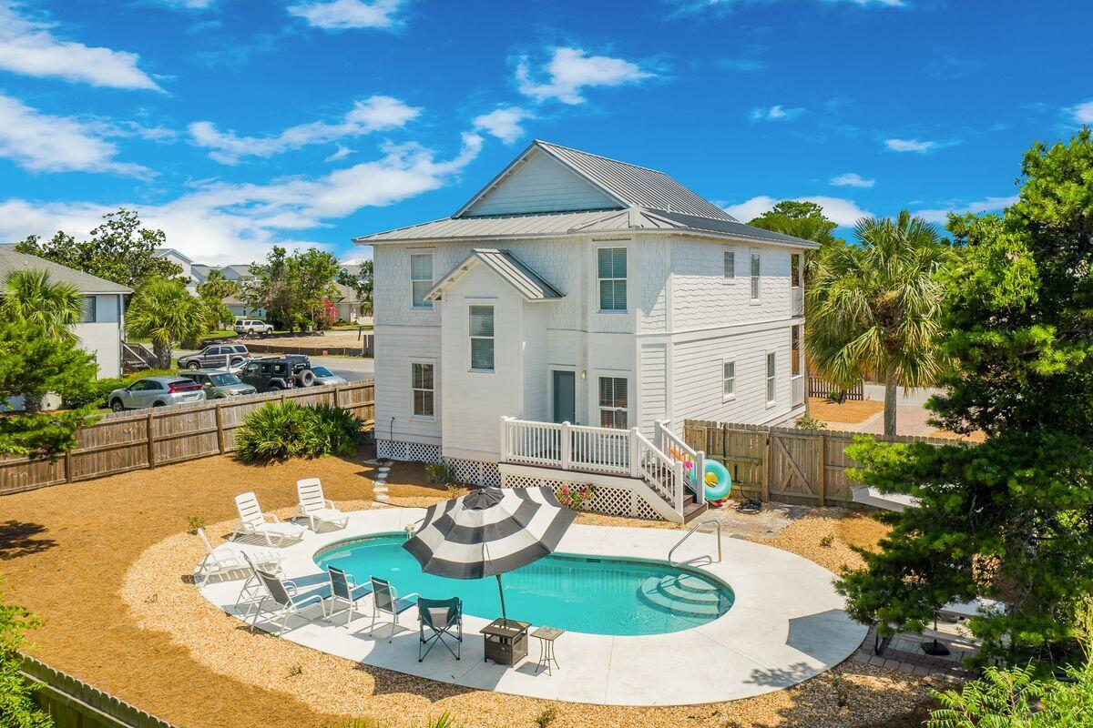 Primely positioned just two blocks from the sugar-white sands of the Emerald Coast's best beaches and boasting over $111,000 in gross annual rental income year-to-date, 275 Payne Street is the quintessential vacation home. This six bedroom home has an oversized 74x114 lot that provides the creative investor ample opportunity to expand the outdoor living and entertainment space that the home already provides. The exterior features a large driveway with six parking spaces, and a large pool surrounded by a spacious backyard with room to add features such as a summer kitchen, putting greens, and more.