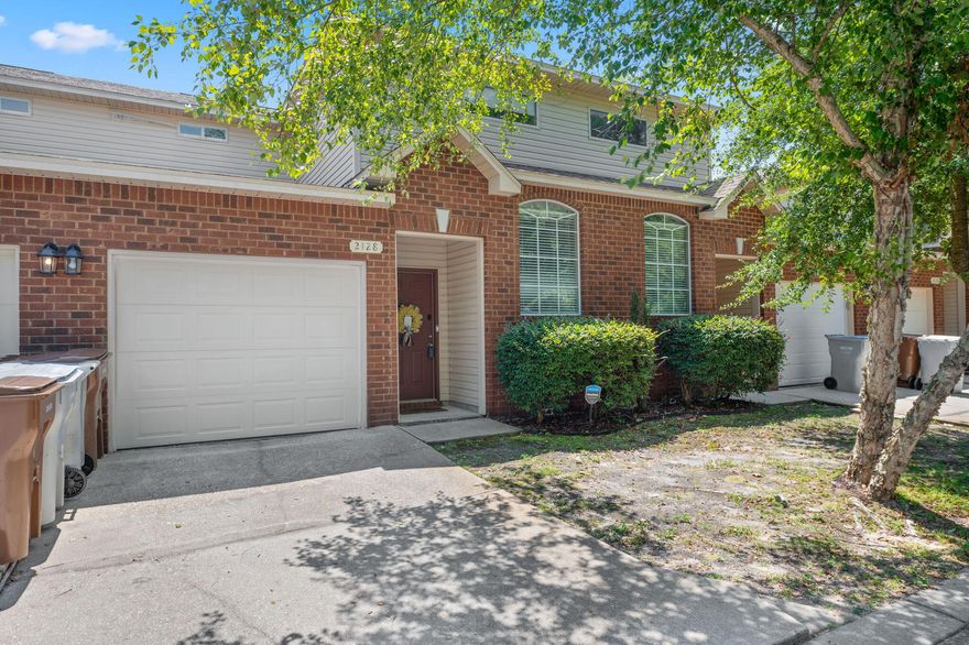 Newly VACANT and ready for new home ownership! This adorable townhouse features a one car garage and a split bedroom floor plan.. The kitchen opens up to the living room space and outdoor patio area. The master retreat room is on the first floor and has a walk in closet and large bathroom. The laundry room is on the first floor and already equipped with a washer and dryer as a bonus for you!! The brand new water heater is in the closet next to this space as well. As you work your way upstairs, you will notice the natural lighting pouring through the window that has a set of custom shades that come down with a remote. The HVAC system is upstairs in the hallway area and so are several closets for extra storage in the home. 2 extra bedrooms and a full bathroom are upstairs.