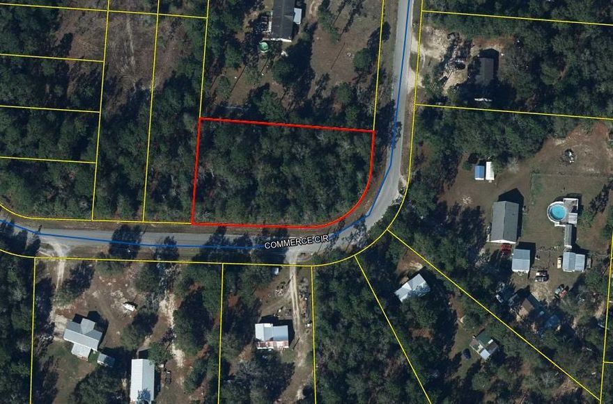 Come check out this large lot in the city limits of Defuniak Springs on Commerce Circle. Available as one lot so that you can have a huge yard or can be divided (already surveyed) into two lots. Perfect for a builder looking to build homes on. Don't let this one get away!