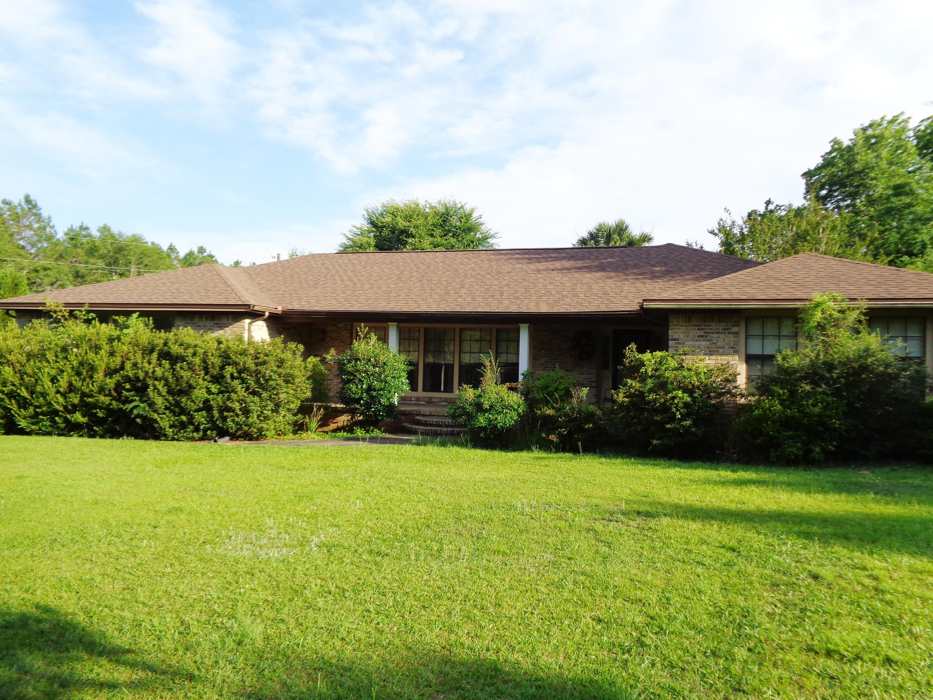 10 Acres plus 2,561 sq ft Brick home (3,734 sq ft under roof). Extra large rooms throughout. Home features a formal living/ dining room, spacious family room with wood burning fireplace and doors to the screened porch plus kitchen with breakfast nook. Extra cabinets in the kitchen with breakfast bar, a cabinet pantry plus a desk area. Laundry has a sink and storage cabinets. The oversized master bath has a walkin closet, 2 vanities, jetted tub plus a separate shower. Closets line the hallway into the master bedroom. The additional bedroom also has a walkin closet. Whole house Generator. On the back of the home is a screened porch facing the wooded area of the property. Plenty of room for everything - garden area for your own produce or horses and chickens. Perfect Country Living. As-is.