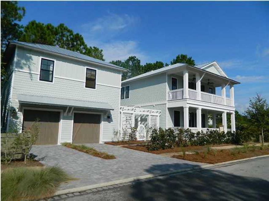 There's something for everyone in this beautiful new WaterColor residence from Weekley Homes with 5 bedrooms, 5.5 bathrooms, a bunk room and a guest retreat over the garage. A covered porch leads to both the entry way and a wraparound open air deck for soaking up the bright Florida sunshine and warm gulf breeze. On the main floor, you'll find spacious open concept family, dining and kitchen areas, a powder room for guests and a bedroom with en suite bathroom. The kitchen is equipped with a fantastic Jenn-Air Pro Style Appliance package, marble countertops and a marbled backsplash. Additional home features include whitewashed hardwood flooring throughout, marble bathroom countertops, tile and stone bathroom flooring with glass tile wall accents.