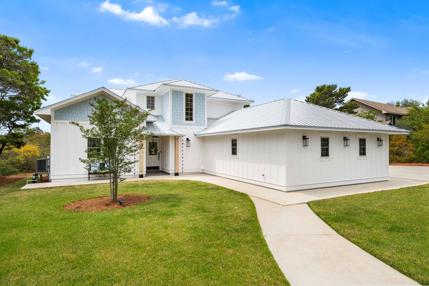 Excellent opportunity in a luxury neighborhood! Boasting 0.58 acres, this residence boasts an unmatched location in Blue Mountain Beach. This four bedroom home has a huge front yard, long driveway, two-car garage & peaceful backyard with room for a pool. This property can be your ideal full-time residence, rejuvenating second home or top-producing investment property with rental projections at $93,800 annually. This prominent escape has tremendous curb appeal and a great floor plan with two separate living rooms and a primary suite on the first level. In addition, you have a formal dining room as well as a breakfast area by the kitchen. On the second level, there are 3 bedrooms & 2 full bathrooms. The home has a nice window package allowing for tons of natural light to pour in. The main living room has vaulted ceilings. The oversized two-car garage has a lockable storage room running the full length of the garage. The property has smart home features, solid core wood doors and excellent storage. The exterior has been upgraded with a total refreshment in 2025. Surrounded by luxury 30A homes, 79 W Blue Coral Drive is situated on a quiet street with no HOA. This home is easily walkable to dining, shopping and entertainment options. This property offers ultimate convenience being just a quick 5 minute golf cart ride from the beach, 5 minutes from Gulf Place and 10 minutes from Grayton Beach. Explore this sanctuary designed for relaxation, connection and unforgettable memories on the coast!
