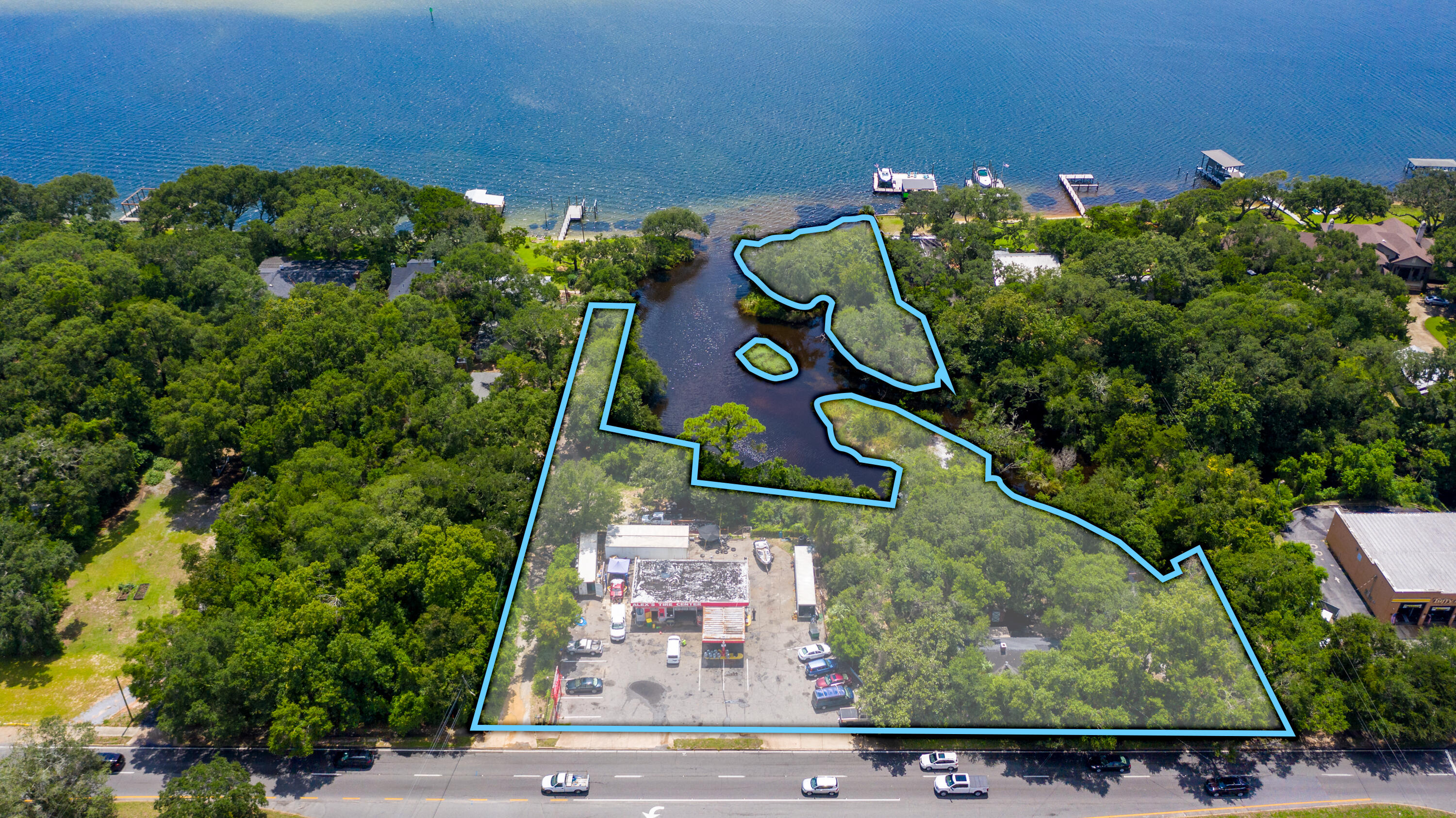 ***SELLER WILL FINANCE*** Multi-Parcel sale to include six platted commercial lots covering a total of 1.67AC +/- and approximately 315' frontage on US Highway 98 (2020 AADT 34,000 - 43,000 within 1/10 mile) with approximately 400' of water frontage on an inlet to the Santa Rosa Sound which in turn provides access to the Choctawhatchee Bay and Gulf of Mexico. The site includes two existing structures; one is a free standing steel frame building covering 1,372SF and functioning as an Auto Service / Tire Shop with frontage on Highway 98, the second is a single family home covering 1,498SF with two bedrooms and one bath. Potential uses include: private Marina or Watersport and Boat Rentals, Multi-Family (apartment or condo), Hotel/Motel, Vehicle Sales, Restaurant, Commercial Amusement, et