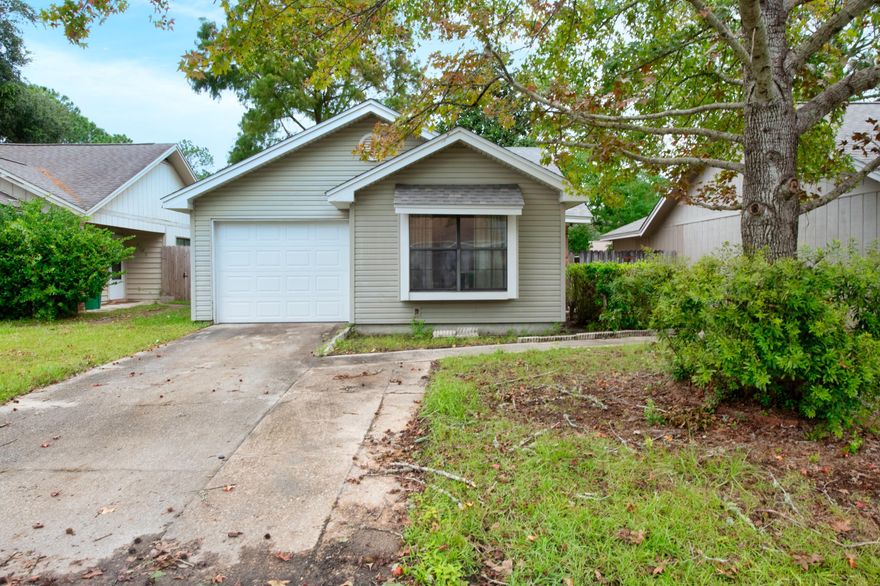 GREAT OPPORTUNITY TO BUILD SOME SWEAT EQUITY AND MAKE THIS PLACE YOUR OWN! NEW ROOF 2020. Quiet cottage available now! Mahogany-tone laminate throughout the main living and dining areas. Sliding doors in master bedroom allow for plenty of natural sunlight. The fenced backyard gives you privacy both in and out of your home with access through the master bedroom, kitchen, and dining area. This home also features a dedicated laundry room, attached garage and a small brick patio off the kitchen. Schedule your showing today! PROPERTY SOLD AS IS.