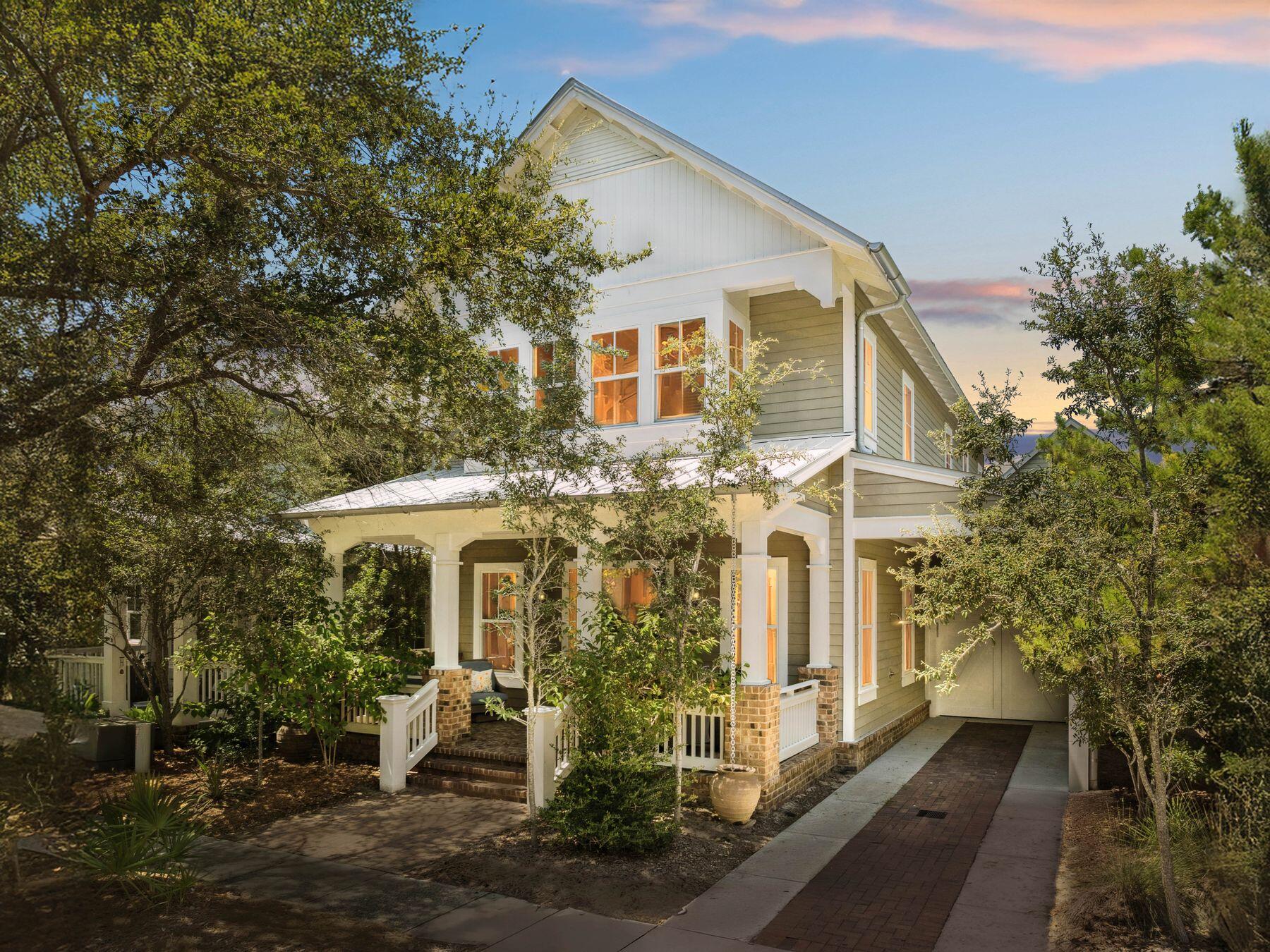 Impeccably designed and move-in ready, this stunning craftsman-style home offers the perfect blend of style, comfort, and convenience. Home being sold fully furnished and no updating or remodeling is required. From the time it was built, this property was thoughtfully enhanced with many custom upgrades, including fencing, privacy landscaping along the back, and an extended brick paver patio that creates an inviting outdoor courtyard retreat. Inside, you'll find upgraded wood flooring throughout, coastal modern cabinetry, quartz countertops, and upgraded stainless steel appliances. The open-concept main level is accented with custom millwork, exquisite lighting, and thoughtful finishes that showcase quality at every turn. Designed by Chris Stoyles at Archiscapes and built by Turner Legacy Homes, this residence has been gently used as a second home and lovingly cared for. The flexible floor plan features two primary suites, one conveniently located downstairs and another upstairs, plus a second-level living area that's ideal for a home office, studio, or bunk space. Located across from the community pool, this home also includes a one-car garage and a carport for ample parking. Enjoy the convenience of nearby Gulfview Heights Beach Access and being just moments from popular restaurants, shops, and entertainment along 30A.