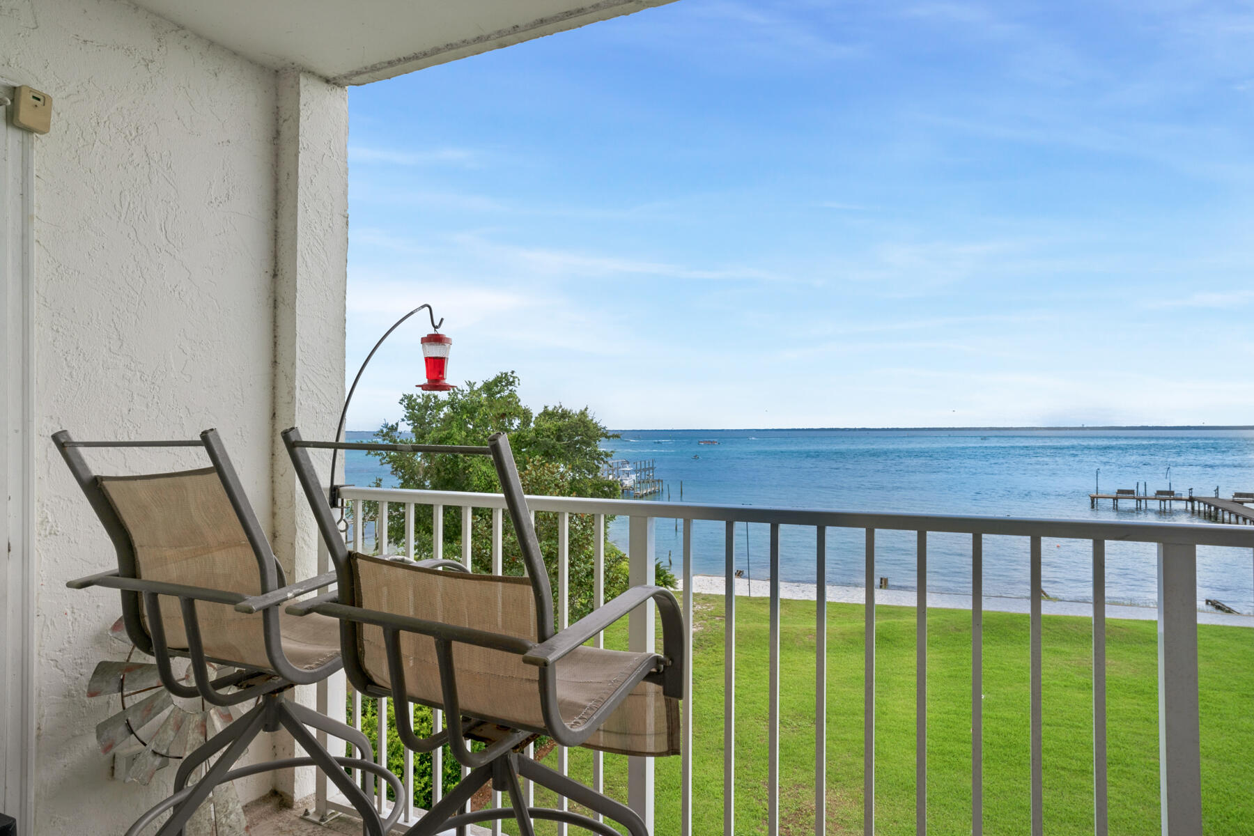 Wow! What a great price for 1 Bedroom Bay View condo in a great location! Valencia condos rarely come available. This 3rd floor end unit is quiet, peaceful and at a well-maintained complex. There are 2 elevators, so no need to worry about the stairs. Your spacious balcony is WATERFRONT and directly overlooks the pool and the Bay for stunning sunsets, boat and dolphin watching. Great as a second home, permanent residence, or long-term rental investment, the complex is quiet, financially stable, and near all the amenities Destin has to offer as well as Public Parks! Complex includes many additional amenities that add to the charm of this property: bay front pool, clubhouse, community dock, sandy beach, tennis court, car wash station, 24-hour video surveillance and community