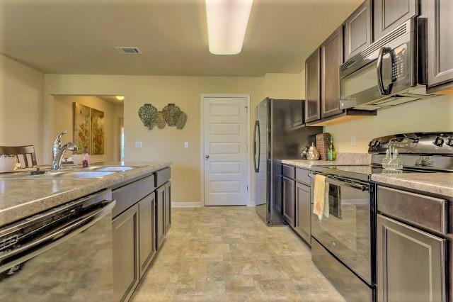 The Aria is a one story floor plan featuring 3 bedrooms, 2 baths, covered back porch & 2 car garage. The open kitchen features an island, stainless appliances and granite countertop. The kitchen opens to the great room w/ access to the covered porch. The master suite is just off the back side of the house & master bath features a separate shower, walk in closet, dual sinks & large soaking tub. Pictures, photographs, colors, features, and sizes are for illustration purposes only & will vary from the homes as built. Home & community information including pricing, included features, terms, availability and amenities are subject to change and prior sale at any time without notice or obligation. Estimated completion is Feb/March