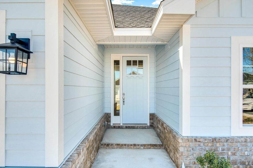 For a limited time...  4.99% fixed rate financing (FHA/VA) + up to $10K flex money + builder pays most closing costs with a preferred lender.    New Craftsman style home with a brick skirt and Hardiboard siding.  20 minutes to Blue Mountain Beach on the Gulf of Mexico. 3 BR / 2 BA with 2 car garage + garage door opener, cathedral ceiling, 8' entry doors, large covered rear patio 15' x 9', quartz countertops, CoreTec Pro Plus Luxury Vinyl Plank flooring throughout, no carpet.  Separate garden tub + shower in Master Bath, Moen faucets, lever handled hardware, attic pull-down stairs.