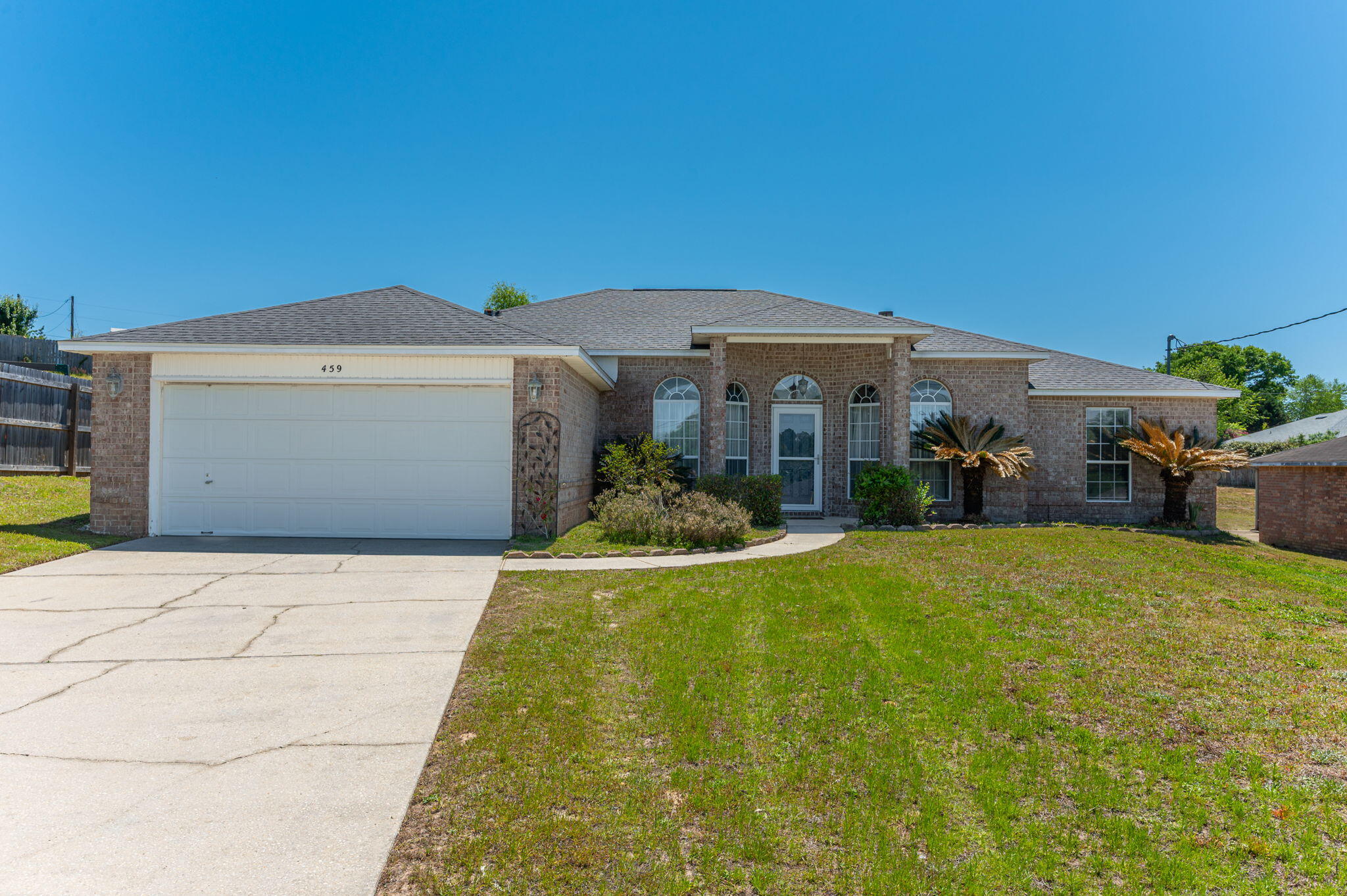 This stunning 4 bedroom, 2 bathroom home is conveniently located South of I-10 in Crestview. This well-maintained property sits on a 0.53 acre lot and boasts a huge back yard perfect for outdoor entertaining and relaxation. Inside, you'll find a spacious kitchen with stainless steel appliances, a convenient island with storage and a breakfast nook, ideal for enjoying meals with loved ones. The master bathroom features a luxurious garden tub, walk-in shower, and double vanity for added convenience. With his and her walk-in closets and LVP flooring throughout, this home offers both style and functionality. This home is a must see! Contact us for a showing before it is gone!