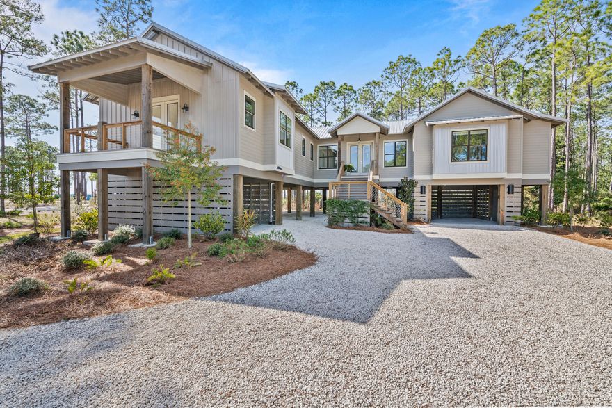 Nestled in the sought-after RiverCamps on Crooked Creek community, this meticulously crafted Romair construction sits on a 1.1-acre lot with stunning views of West Bay. RiverCamps has a boat launch with direct water access to Crooked Creek, West Bay, and ultimately the Gulf of Mexico-offering unmatched access to some of the area's most scenic waterways. Boat to Uncle Ernie's Restaurant and Shell Island in 15 minutes! Enjoy kayaking, paddleboarding, fishing, or simply enjoy water views from your living room. This gated, luxury community also has a wildlife sanctuary that sprawls 1,500 acres.  Residents can enjoy miles of trails that wind through the community, bird watching, camping, and pickle ball. A brand new community pool is set for completion in May. Adorned with beautiful architectural details throughout, this 3 bedroom, 4 bathroom retreat has room for a pool and showcases craftsmanship and elegance. Enjoy spaciousness and natural light with high ceilings that amplify the sense of openness. A dreamy screened-in back porch with porch swing bed invites you to relax and take in water views, while an outdoor kitchen and shower enhance the outdoor lifestyle. Equipped with high-end appliances, including a Wolf gas range, Sub-Zero fridge, built-in microwave, dishwasher, and range hood, the gourmet kitchen is a chef's dream. The huge quartz waterfall island has plenty of room for additional seating or casual meals and the open living/dining area is perfect for entertaining family and friends. There is a pantry for additional storage, tile backsplash, single-basin sink, and plenty of counter space for preparing meals.  Additional features include luxury vinyl plank flooring, powder room, gas fireplace, shiplap ceilings, and recessed lighting.

The spacious primary suite has a walk-in closet and an en suite with freestanding tub, walk-in shower, and double vanity with quartz countertops. Enjoy your mornings on the covered balcony with bay views. Two generously-sized guest bedrooms are located on the other end of the home for privacy and both have en suites with walk-in showers and pedestal sinks. There is a large, dedicated laundry room with sink, tile backsplash, quartz countertops, and built-in cabinetry for storage.

RiverCamps is conveniently located less than 7 miles from Northwest Florida Beaches International Airport, less than 10 miles from Panama City Beach, and a 25-minute drive from Rosemary Beach and 30A. Schedule a showing today! Buyer to verify all pertinent information in listing. Seller will include Engineered plans for bottom floor enclosure, providing the opportunity for future expansion and customization. 

