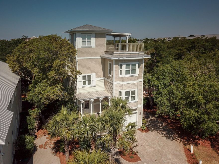Stunning custom built home just 1 block to the gulf with extraordinary views of the gulf and Big Redfish Coastal Dune Lake. This 4 level house sleeps 20 people and is a rental machine! The rental projection for 2018 is over $137,000! This home has been completely renovated and updated. Boasting the largest rooftop deck in Blue Mountain, it is equipped with 42'' flat screen TV, full wet bar, and stereo system for you to enjoy dinner, drinks or simply some chill-out time gazing out at the unmatched views. There is also a large heated pool with plenty of space to lounge on the brick paver sun deck. This home is equipped with an elevator to easily travel to 3 floors. The great room is on the 3rd floor and is surrounded by large, sunny windows, maximizing the remarkable, panoramic water