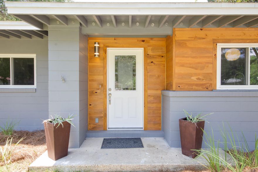 BACK ON THE MARKET! This stunning Mid Century Modern Coastal pool home is sure to impress! PRIME location in the highly desired Elliott Point neighborhood. This solid concrete block 4/2 was fully renovated from top to bottom. Brand new roof, new electrical, new tankless gas water heater, new HVAC, new duct work, new sheetrock, new bathrooms, all new kitchen & appliances, new pool liner, newer windows, all new doors inside and out, new sprinkler pump and timer, new landscaping and sod.The home features luxury vinyl driftwood throughout the living areas + kitchen. The bedrooms feature new carpet and the bathrooms feature new tile. Light, bright and airy---this open concept floorpan is an entertainers dream home.